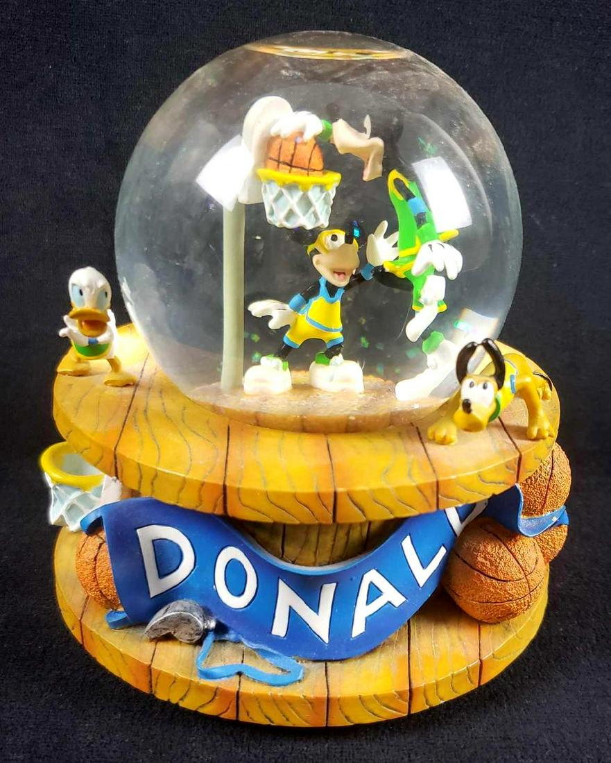 Disney Donald Mickey Goofy Pluto Basketball Snow Globe: Disney Donald Mickey Goofy Pluto Basketball Snow Globe. This snow globe is in great used condition. There is no known damage to the snow globe such as chips, cracks or other imperfections. The snow gl