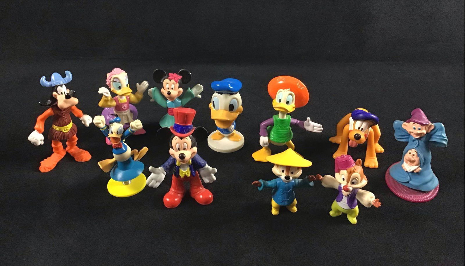 Lot of 11 Vintage Disney Character Toys: This lot consists of a variety of different characters; Donald Duck, Daisy Duck, Minnie Mouse, Mickey Mouse, Goofy, Pluto, Dwarfs, Chip and Dale. They appear to be vintage due to their designs and col