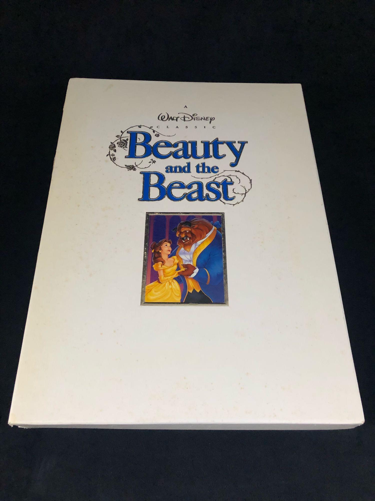 Vintage Walt Disney's Classic Beauty and the Beast: Walt Disney's Classic Beauty and the Beast Deluxe Collector's Edition VHS 1992.This set has been opened but cared for, light staining on front cover.Â ythis set Comes with Beauty and the Beast VHS ,