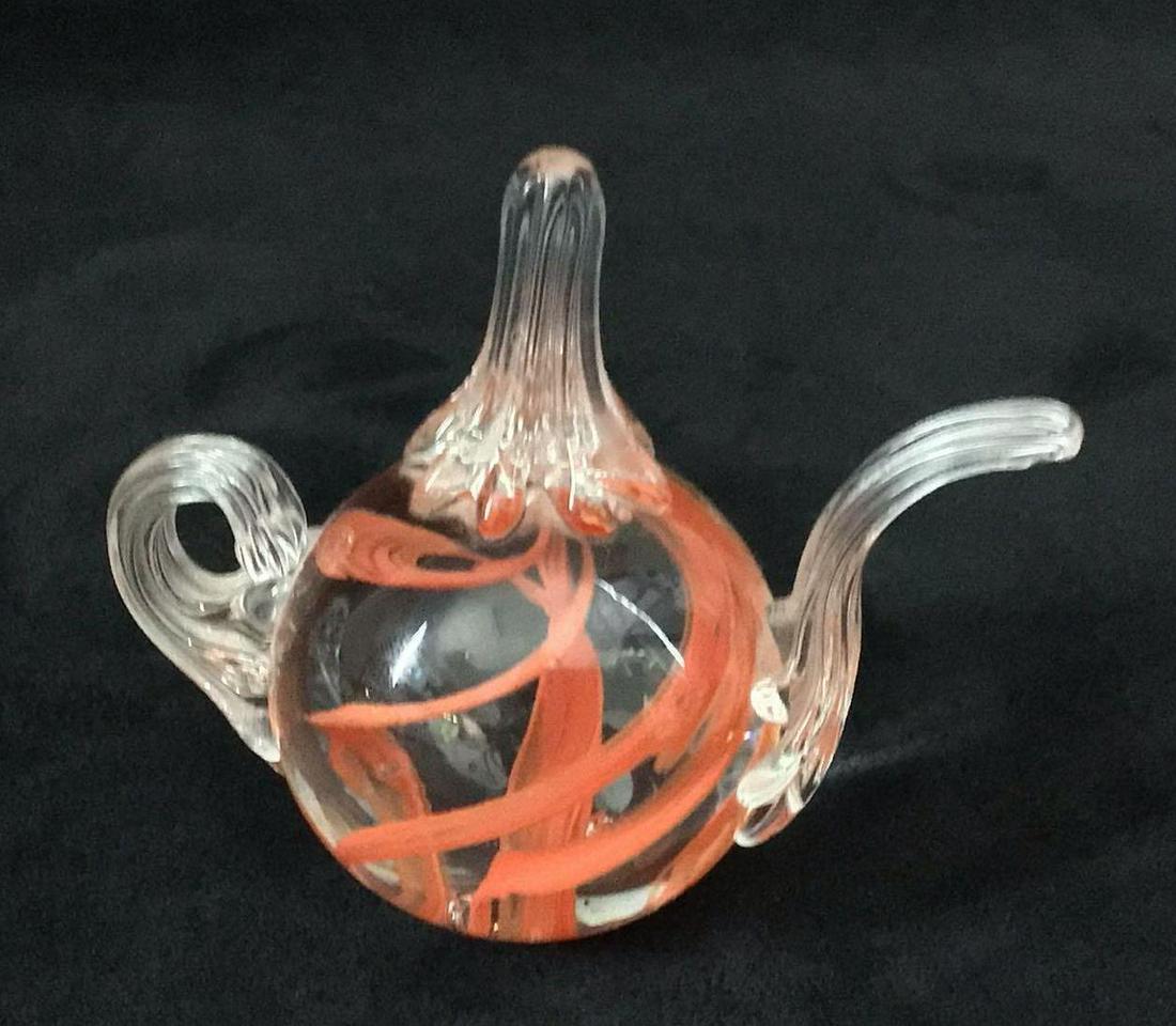 Vintage Glass Art Teapot Prestige 1991 Red: Vintage Glass Art Teapot Prestige 1991 Red. This is a vintage glass art piece that is shaped like a teapot. Inside is a swirl of red design and two bubbles. The underside reads "Prestige 1991". It is 