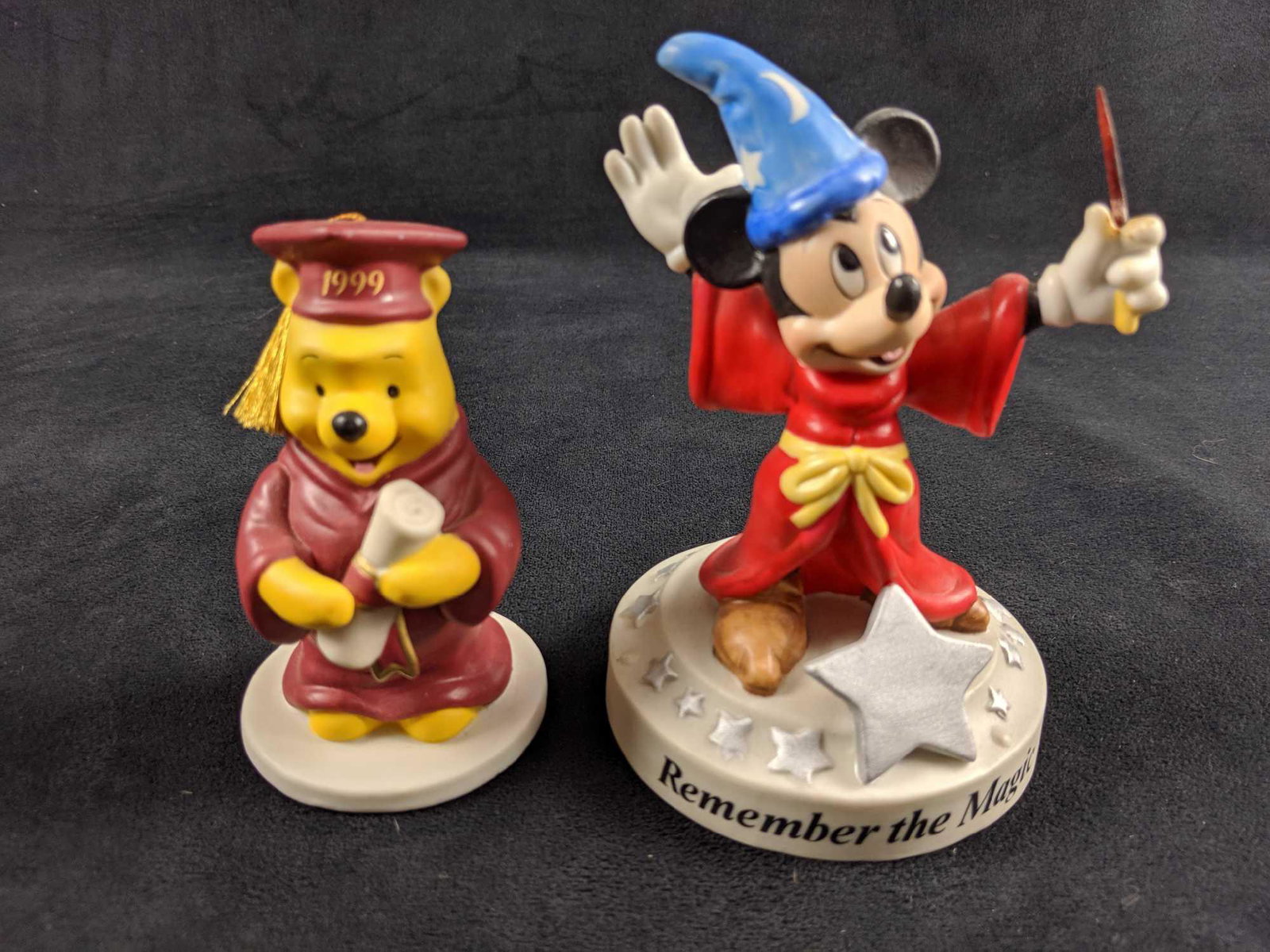 Ceramic Disney Mickey Mouse And Winnie The Pooh Figures: This lot includes: 1. Ceramic Graduation Winnie The Pooh 1999. Made in Sri Lanka. Measures approx 2" x 2" x 4". Pooh Bear is in good, used condition with only a few light smudges on his paws. 2. Remem