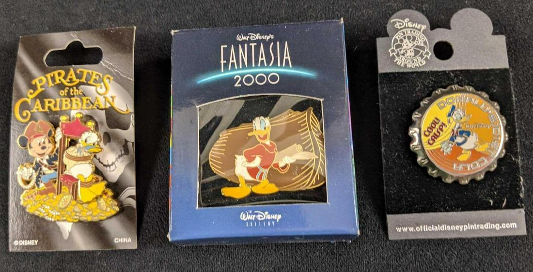 Disney Donald Duck And Mickey Mouse Pin Lot Of Three: This lot of Disney pins includes: One Pirates Of The Caribbean Donald & Mickey pin. One Fantasia 2000 Donald Duck pin and one Donald Duck Diet Cola Bottecap in. These pins are in good, used condition