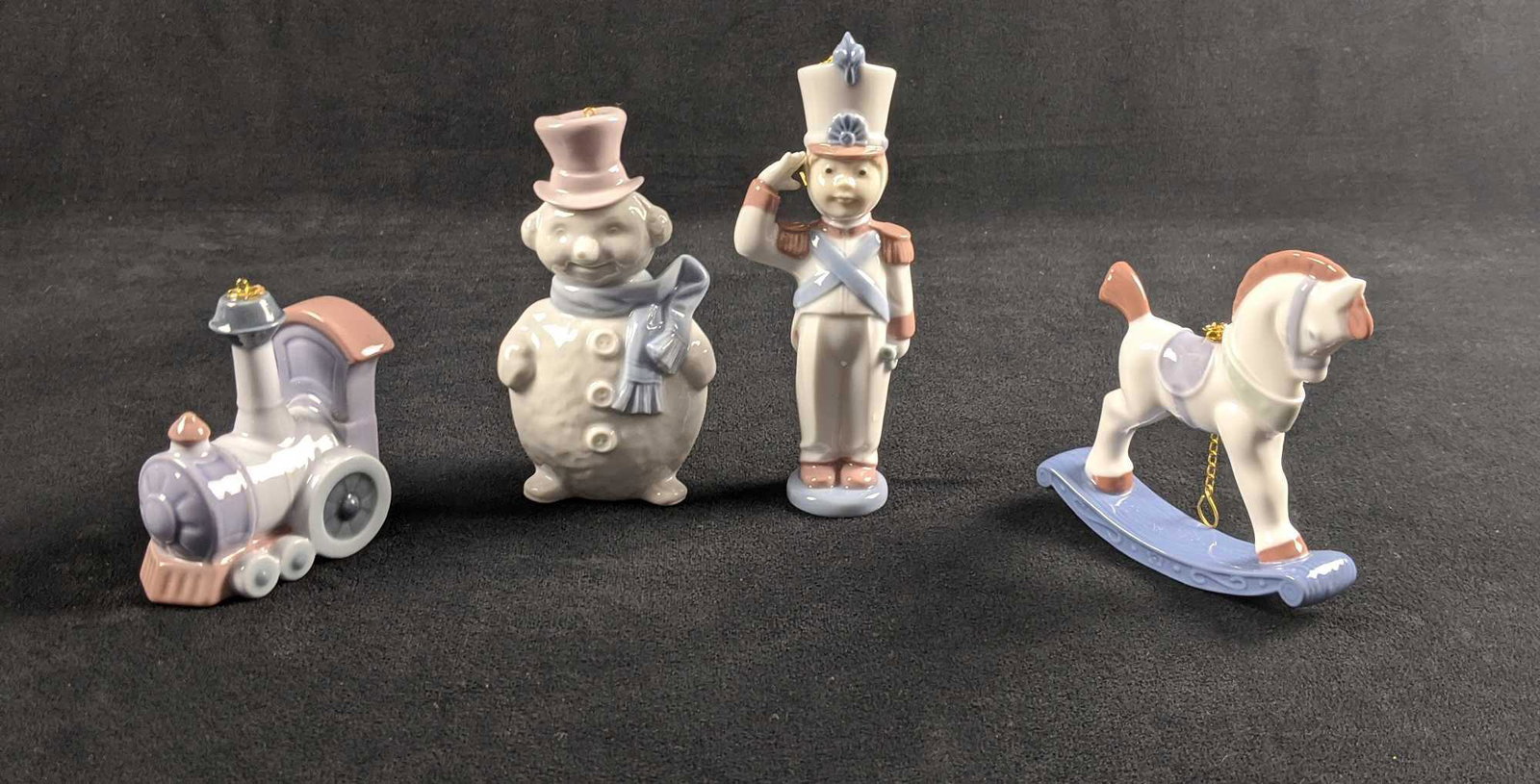Porcelain Lladro Christmas Toys Ornaments Lot Of 4: This LladroÂ Christmas Ornament lot includes: (1) Rocking Horse. #6262. Designed byÂ Jose Luis Alvarez. Retired. Is approx 3 1/2" x 3 1/2".Â (1) Toy Soldier. #6345. Designed byÂ Miguel Angel 