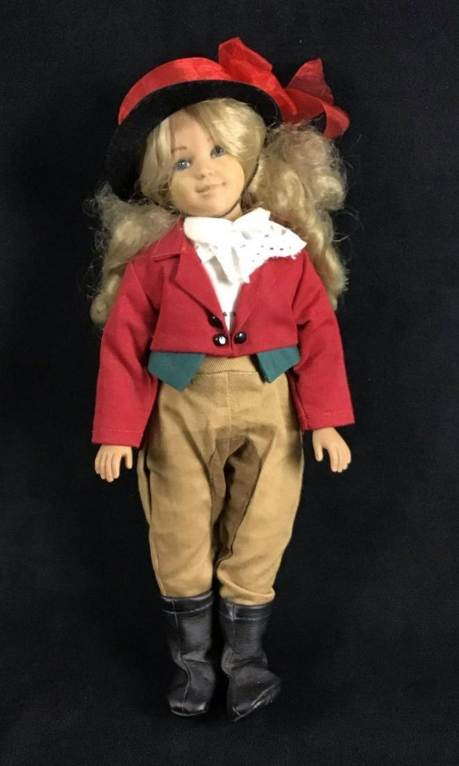 1995 Horse Rider Girl Doll by Unimax Toys LTD: Horse Rider Girl Doll. Manufactured in 1995 by Unimax Toys. Made from vinyl. She is wearing horse rider attire that includes the following; red coat, breeches, black boots, hat, and undershirt. The cl