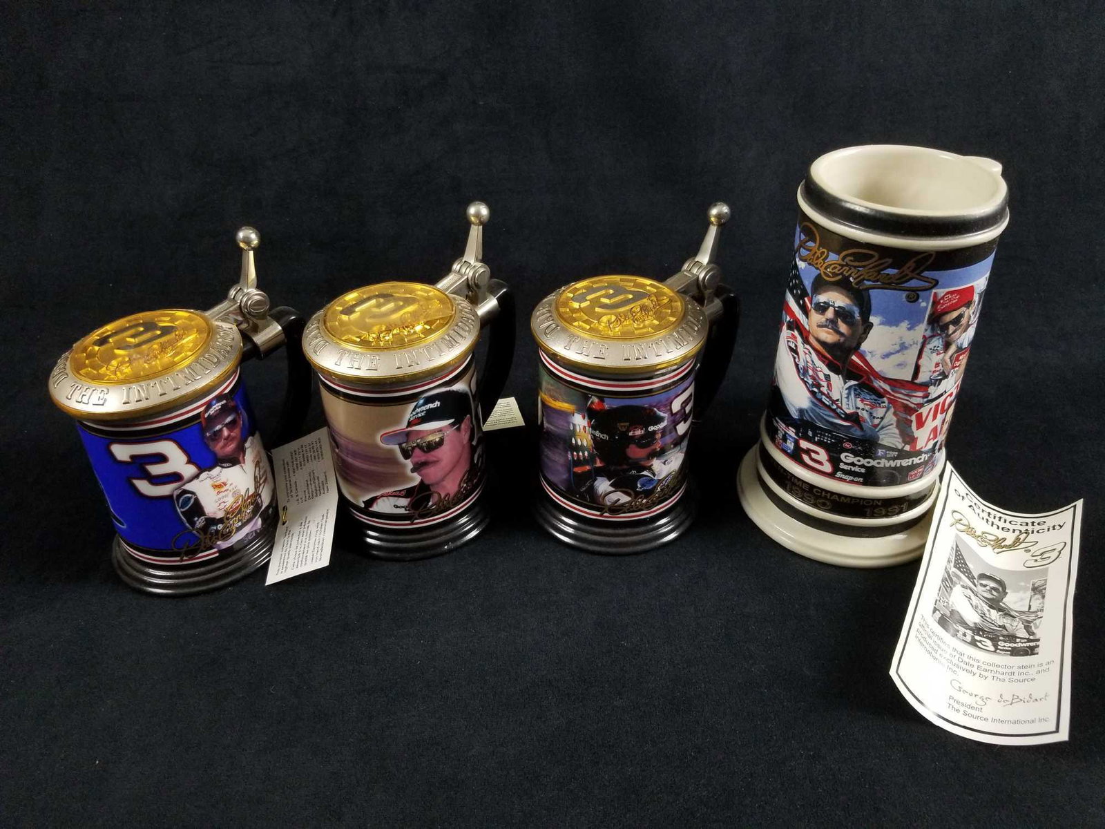 Lot of 4 Dale Earnhardt Collectible Tankards: This lot of 4 Dale Earnhardt Collectible Tankards/ Beer Steins. "The name, signature and likeness of Dale Earnhardt, the style #3 and the likeness of the #3 race car driven by Dale Earnhardt is used u