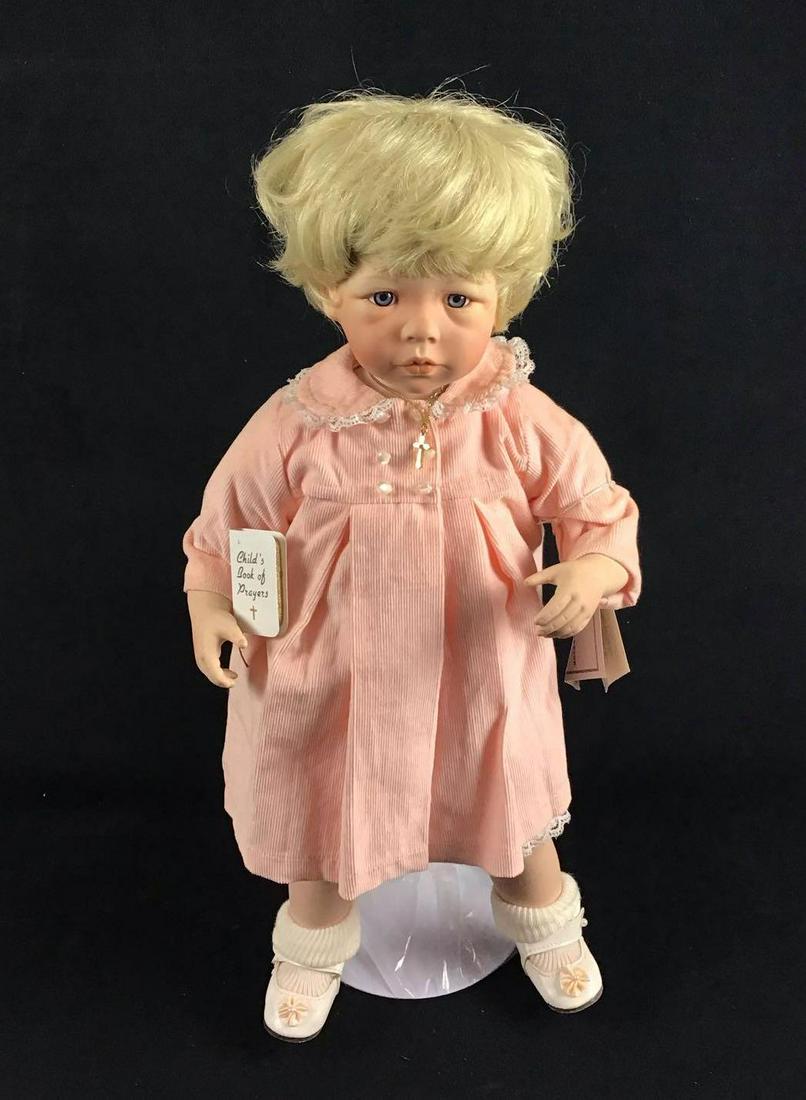 Danbury Mint Vintage 1990s Amanda by Nancy Leslie: Danbury Mint Vintage 1990s Amanda by Nancy Leslie. This is a porcelain doll made by Danbury Mint designed by Nancy Leslie in the 1990s. The doll's name is Amanda and she is wearing her Sunday best clo