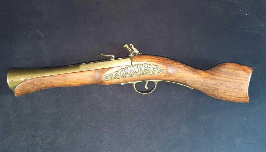 Vintage Pirate Flintlock Pistol Cap Gun: Here is one very cool and very detailed Flintlock Pistol Cap Gun. Made of wood, brass, and metal, there's a good deal of detail from the crazy sea serpent who swims in the rough seas on one side, to t
