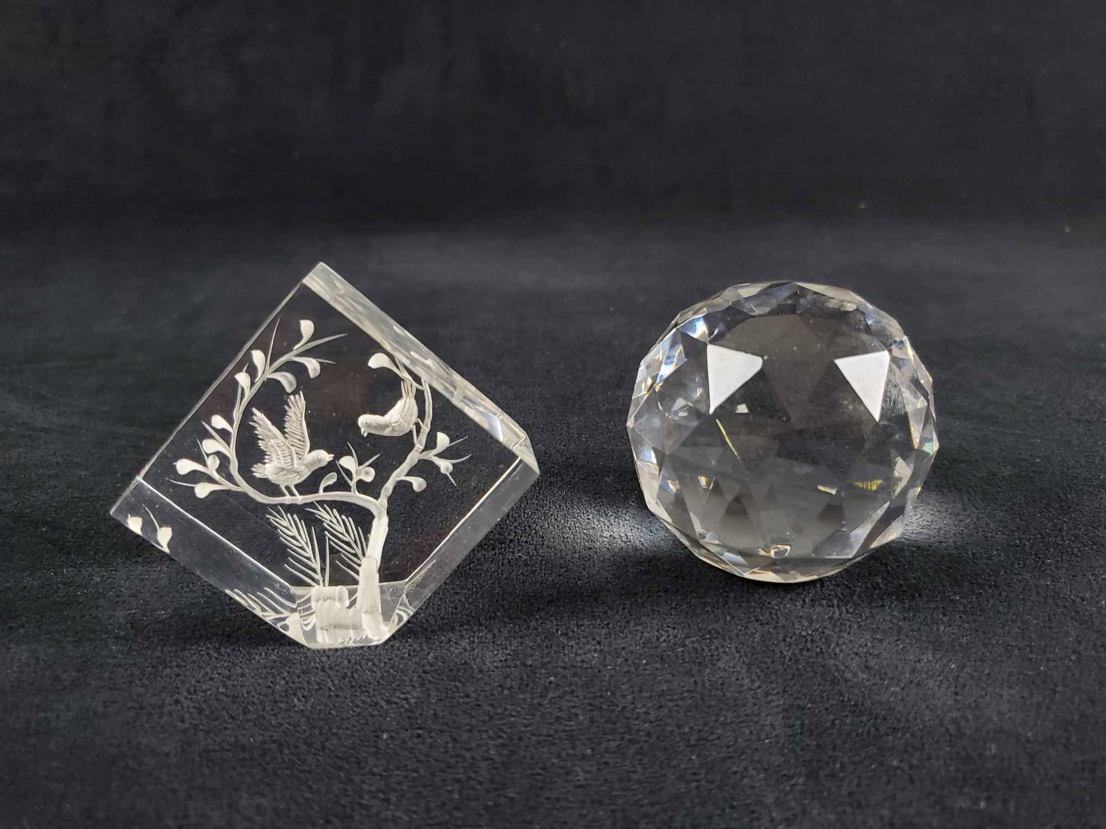 Clear Acrylic Faceted Ball Prism and Bird Block: This lot of two acrylic pieces consist of a faceted gazing ball prism and a block with a branch and birds etched onto the surface. The block with birds was made in Taiwan. The prism ball has a flat bo
