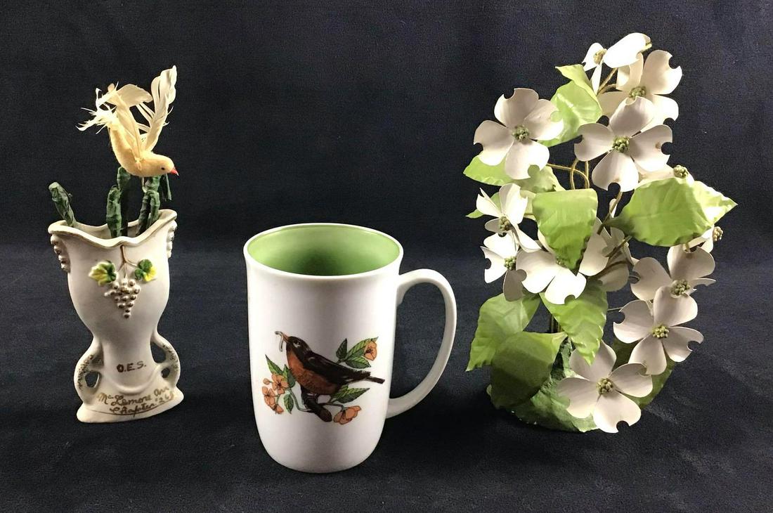Lot of 3 Vintage Circa Late 1900s Fitz and Floyd Neiman: This is a mixed lot of porcelain pieces and a floral arrangement circa late 1900s. They are in good condition with some known scuffs and marks. In total this lot consists of the following; (1) Neiman-