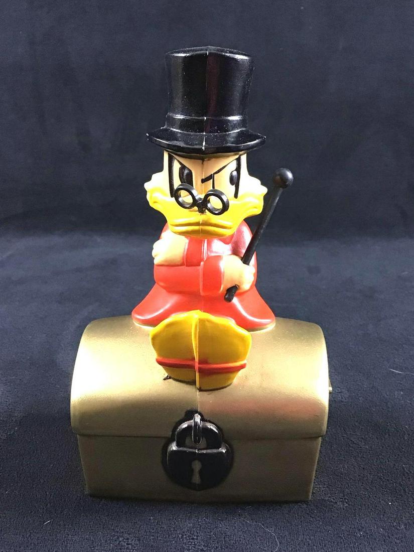 Walt Disney Productions Vinatage Scrooge McDuck: This is a Scrooge McDuck Bank. It was made by Walt Disney Productions. Scrooge McDuck merchandise is hard to come by so this piece is special. It is missing the key but it still makes a great display