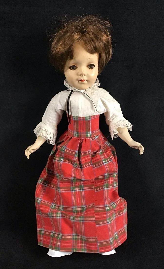 Vintage Midcentury Doll Sleepy Eyes: Vintage Midcentury Doll Sleepy Eyes. This is a vintage midcentury doll with sleepy eyes. She is wearing a plaid skirt with a white shirt and shorts. The shirt has lace accents. The clothes and shoes a