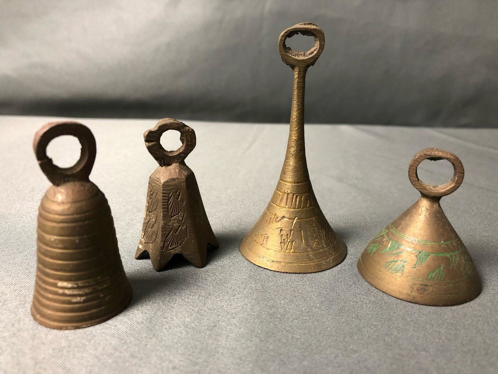 Vintage - Antique Lot Of Brass Hand carved India Bells: Vintage - Antique Lot Of Brass Hand carved India Bells. This lot is in very good condition all bells have ringer intact. Tallest bell is 3" total weight is 104 grams.