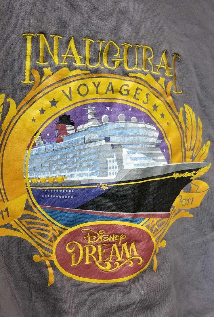 Disney Dream Inaugural Voyages Jacket 2011: 2011 Disney Dream cruise "Inaugural Voyages" gray hooded sweat shirt jacket, with zipper. The jacket is 100% cotton and a size extra large, with front pockets. "Inaugural Voyages" is embroider on the