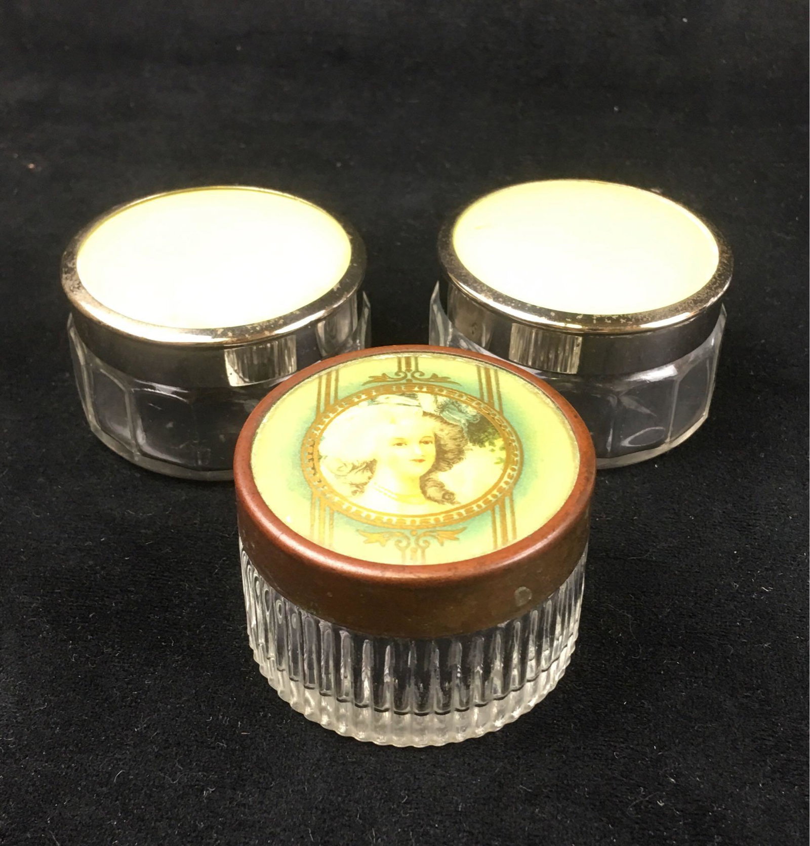 Vintage Cosmetic Jar Pots: Vintage Cosmetic Jars; This set includes a total of 3 jars, each are clean on the inside. One jar has a portrait of a Rococo style women embellished with green and gold, and the other two have silver 