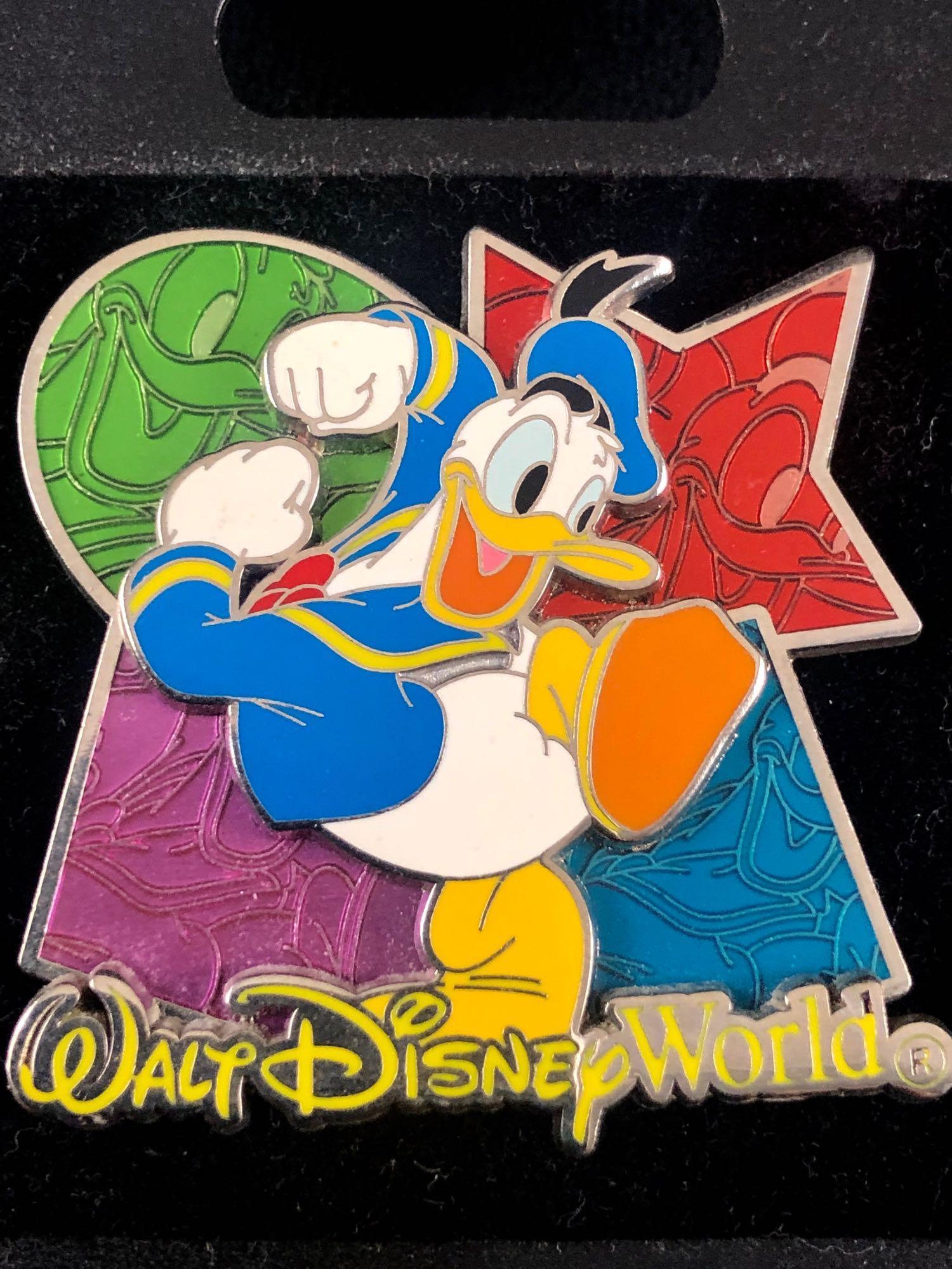Vintage Donald Duck Walt Disney World Souvenir Pin: Vintage Donald Duck Walt Disney World Souvenir Pin Trading Around The World Classic Sailor Donald Duck dancing in front of green, red, purple, blue color shapes showcasing the same happy open bill smi