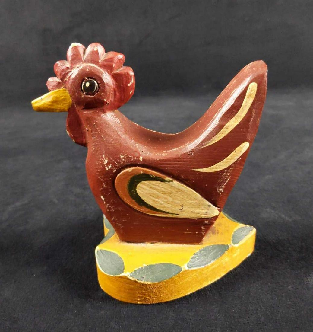 Adorable Hand Carved Painted Rooster Figure: Here is a cute red rooster hand-carved and hand-painted in 1987 by an artist named Sparger. Rooster has a wooden heart base which he sits on. Can be left alone for its vintage look or repainted as a p