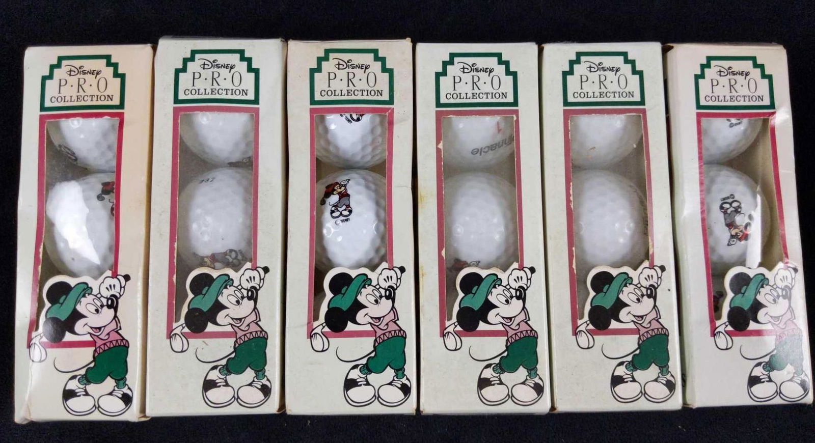 18 Disney Mickey Pro Collection Pinnacle Golf Balls: Here are six boxes of Disney Mickey Mouse Lithium Surlyn Covered Golf Balls by Pinnacle. Each box has three golf balls with the image of Mickey Mouse as he is dressed in old timey golfing clothes whil