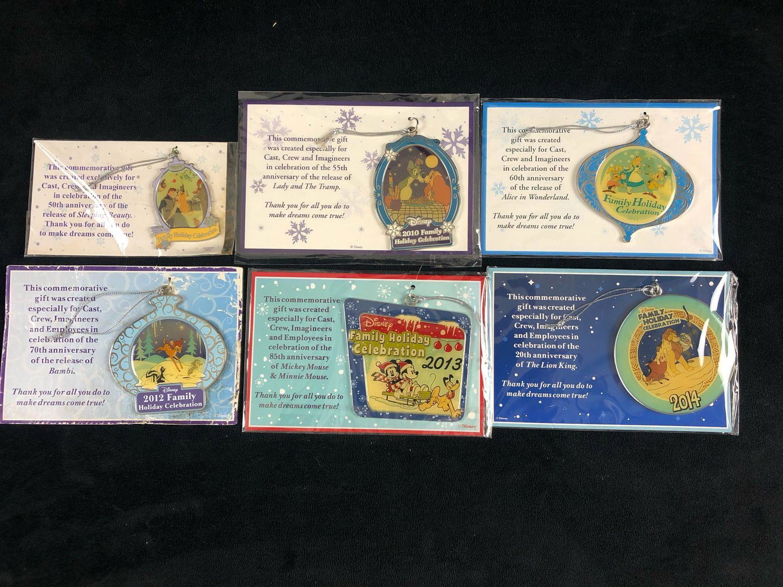 Disney's Official Cast & Crew 2010 - 2014 Holiday Party: Disney's Official Cast & Crew 2010 - 2014 Holiday Party Ornaments .These ornaments are all new sealed except for 2012 is missing the plastic sleeve.