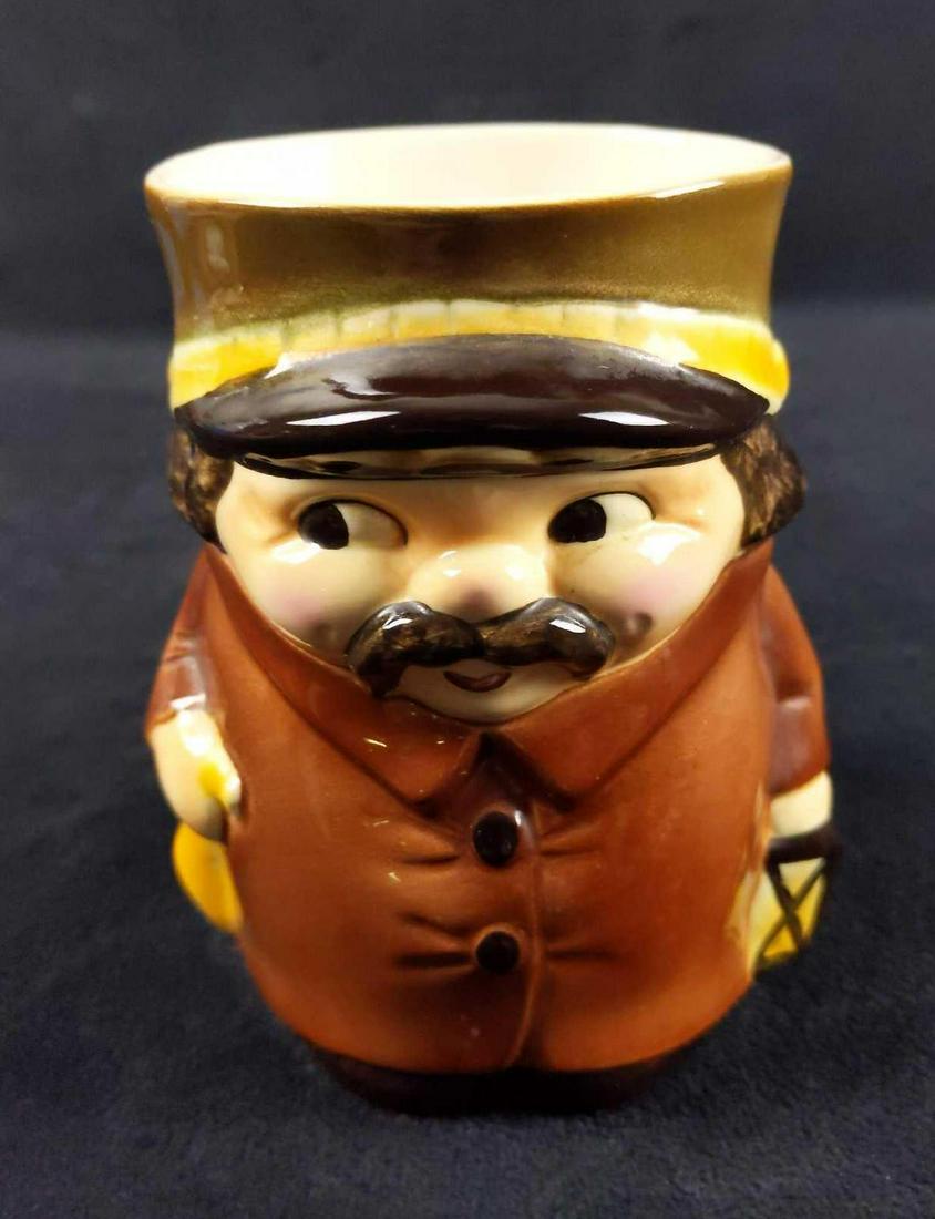 Vintage Goebel Character Mug Night Watchman: Toby Character Mug By Goebel. This one is a village watchman with a mustache holding a horn and lantern. Made of porous earthenware. Made in West Germany. Is approx 6" x 3" x 5". Is in good, vintage c