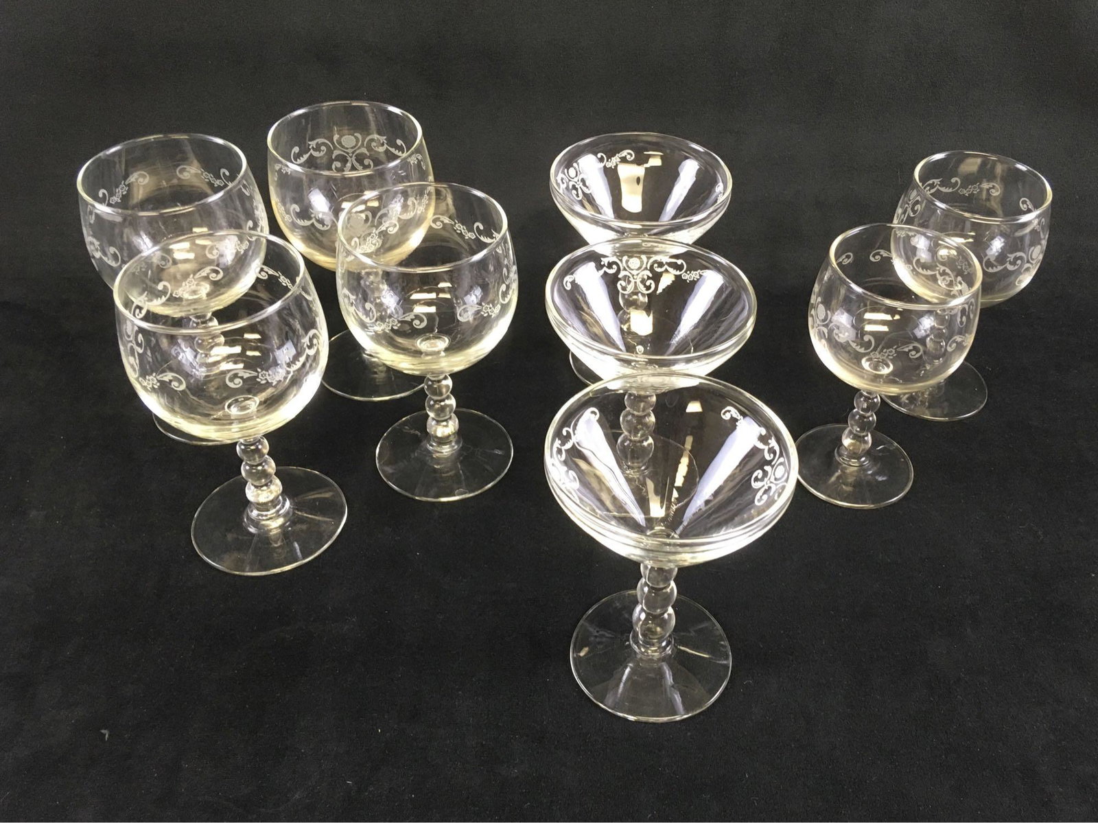 Vintage Etched Champagne Glass Set: Vintage Etched Bar Glass Set; This set comes with a total of 9 glasses. 4 Red Wine Glasses, 3 White Wine Glasses, and 3 Champagne or Coupe Glasses. Each glass features an etched filigree pattern on th