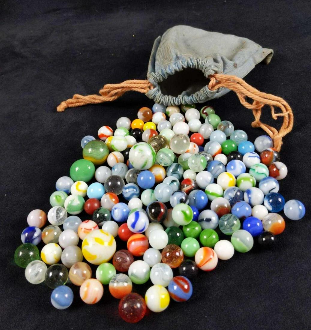 Bag Of Over 100 Vintage Marbles: Here is an old canvas bag of vintage marbles. Marbles of all different sizes, designs, and colors. Some have wearing and some do not. There is at least one hundred marbles in this bag. Bag is approx 6