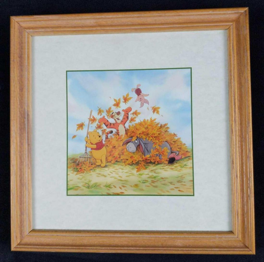 Framed Disney Seasons Fall Print Winnie The Pooh: Here is a framed print of Piglet, Eeyore, and Tigger as they play in a pile of fallen leaves that Winnie The Pooh is trying to sweep up! Framed art is approx 9 1/2" x 9 1/2". Image is approx 5" x 5". 