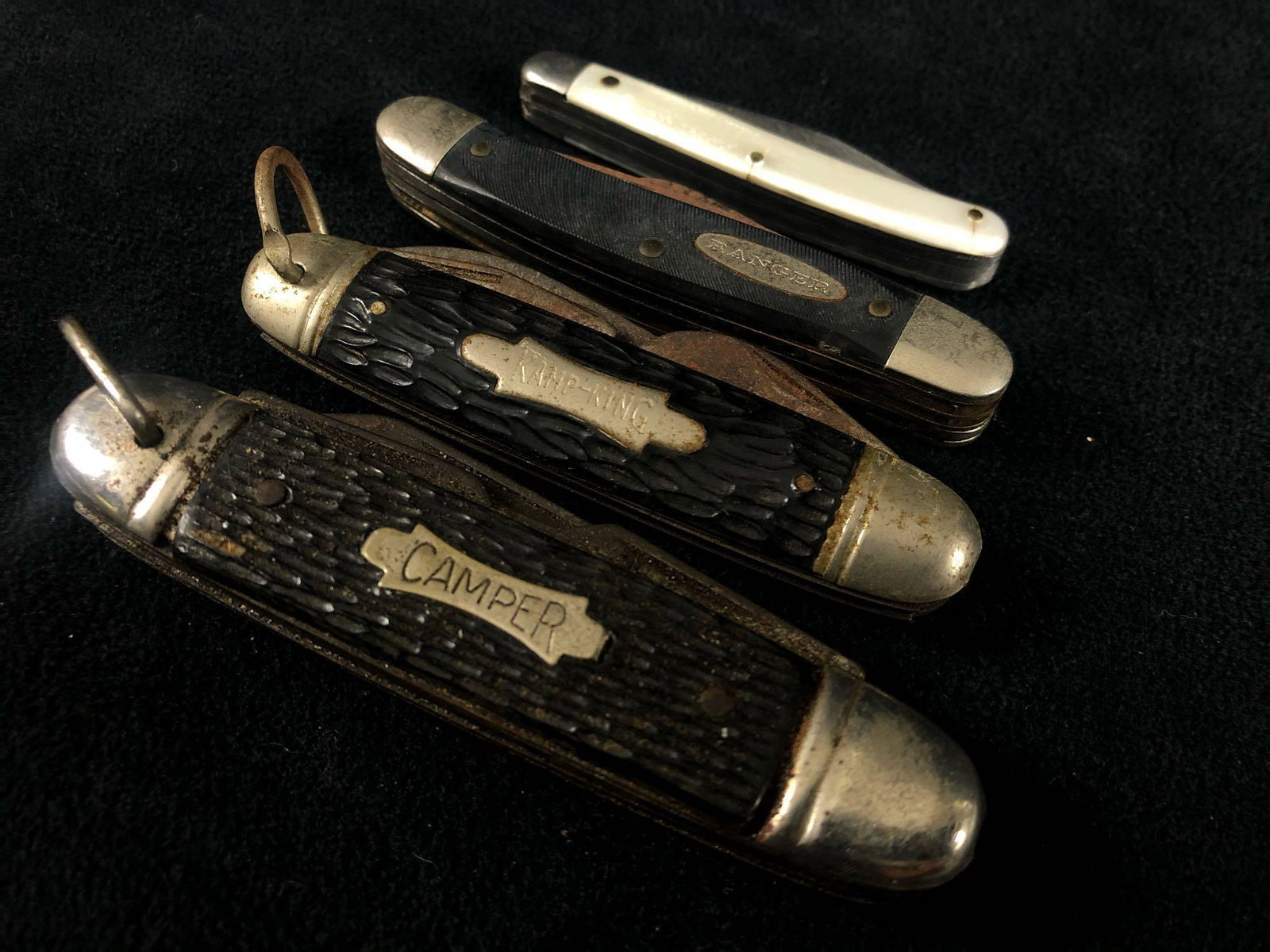 Vintage Lot Of 4 Bone Handled Foldout Camper -Kamp King: Vintage Lot Of Bone Handled Foldout Camper -Kamp King - Ranger - Saber Japan Knives . These knives are in fair condition with some surface rust great for restoration.Please view all our pictures they 