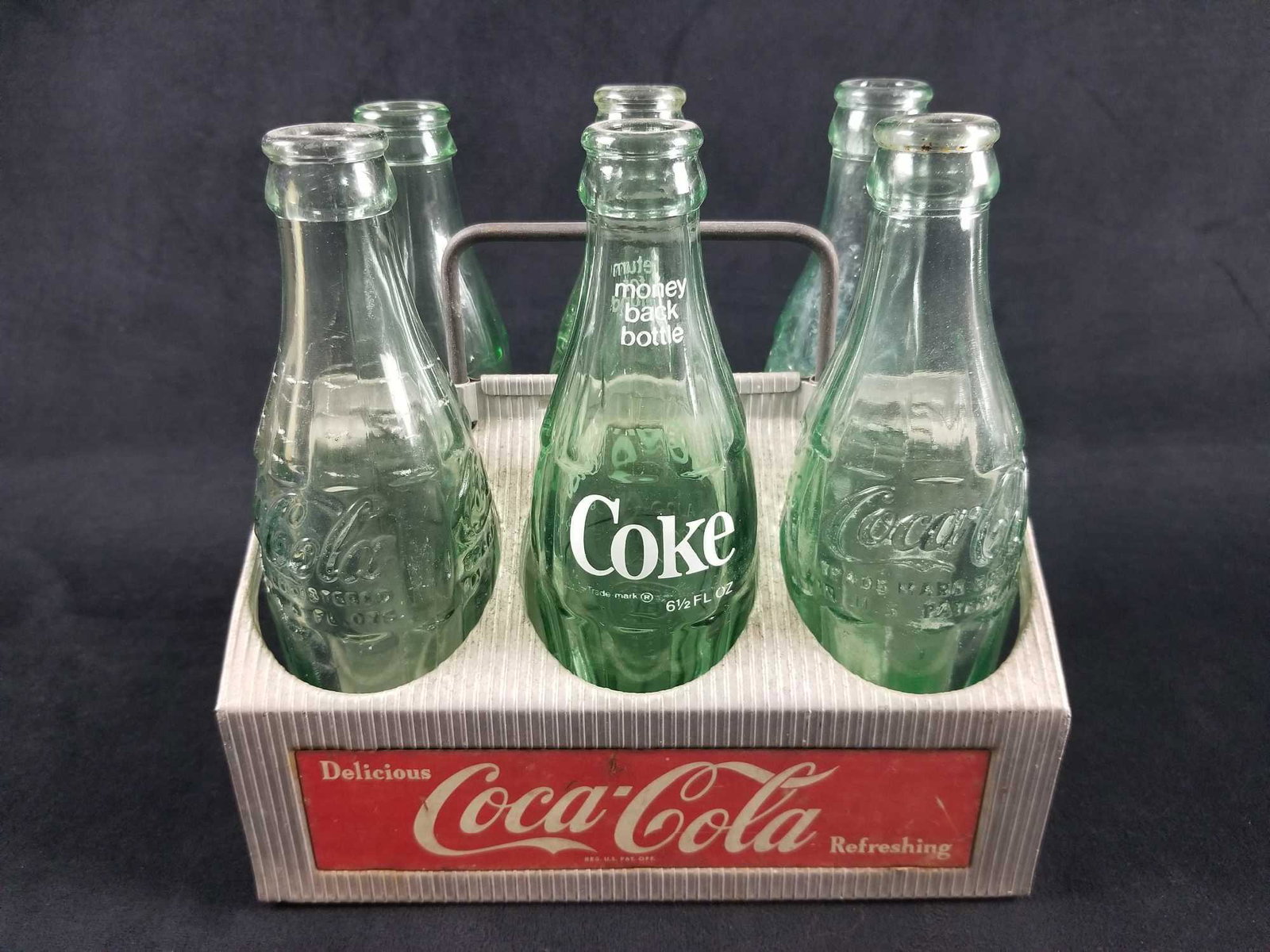 Vintage Vintage Coca-Cola 6 Pack Bottle Carrier Crate: Vintage Vintage Coca-Cola 6 Pack Bottle Carrier Crate Aluminum Tin Green Glass Bottles This lot of collectible Coca-Cola products is overall in great condition. The bottles show no known cracks and th