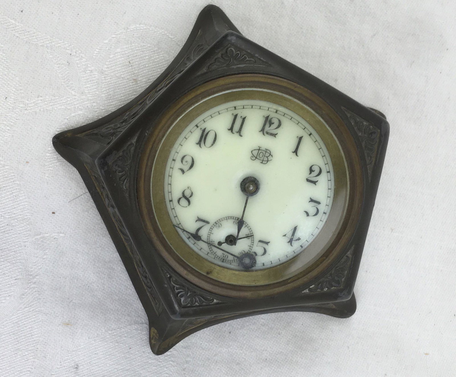 Antique Jennings Brothers Wind Up Desk Clock: Antique Jennings Brothers Wind Up Desk Clock; Very stylish turn of the century desk clock made with silver plate. The clock is no longer functional, the face is a little crooked and the long hand has 