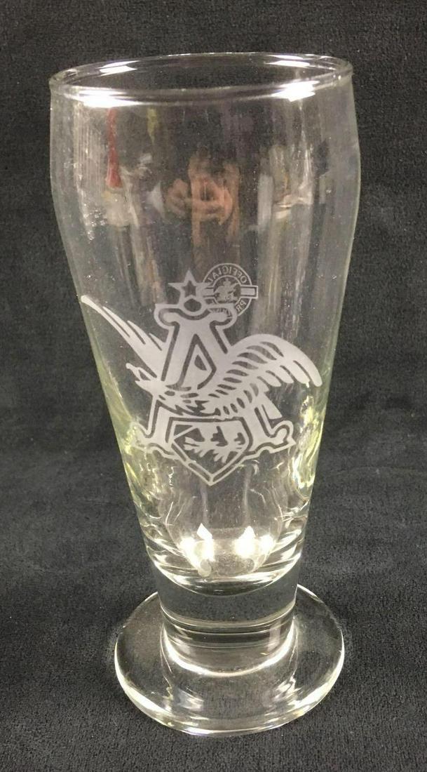 Vintage Etched Beer Glass Anheuser Busch: Vintage Etched Beer Glass Anheuser Busch. This beer glass is in great condition. The glass has no chips or cracks and looks to have rarely been used. The glass measures 6.5" H and approx. 2.5" D at th