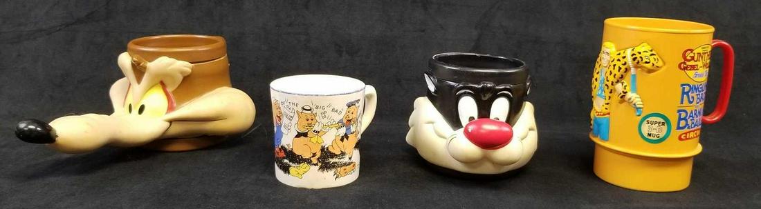 Novelty Cartoon Mugs: Novelty Cartoon Mugs. This set of mugs is in good used condition. The four mugs included are: 1 Wile E Coyote plastic mug. Needs to be cleaned to remove dirt/dust. Measures 8.5" L x 6" W x 4.5" H. 1 G
