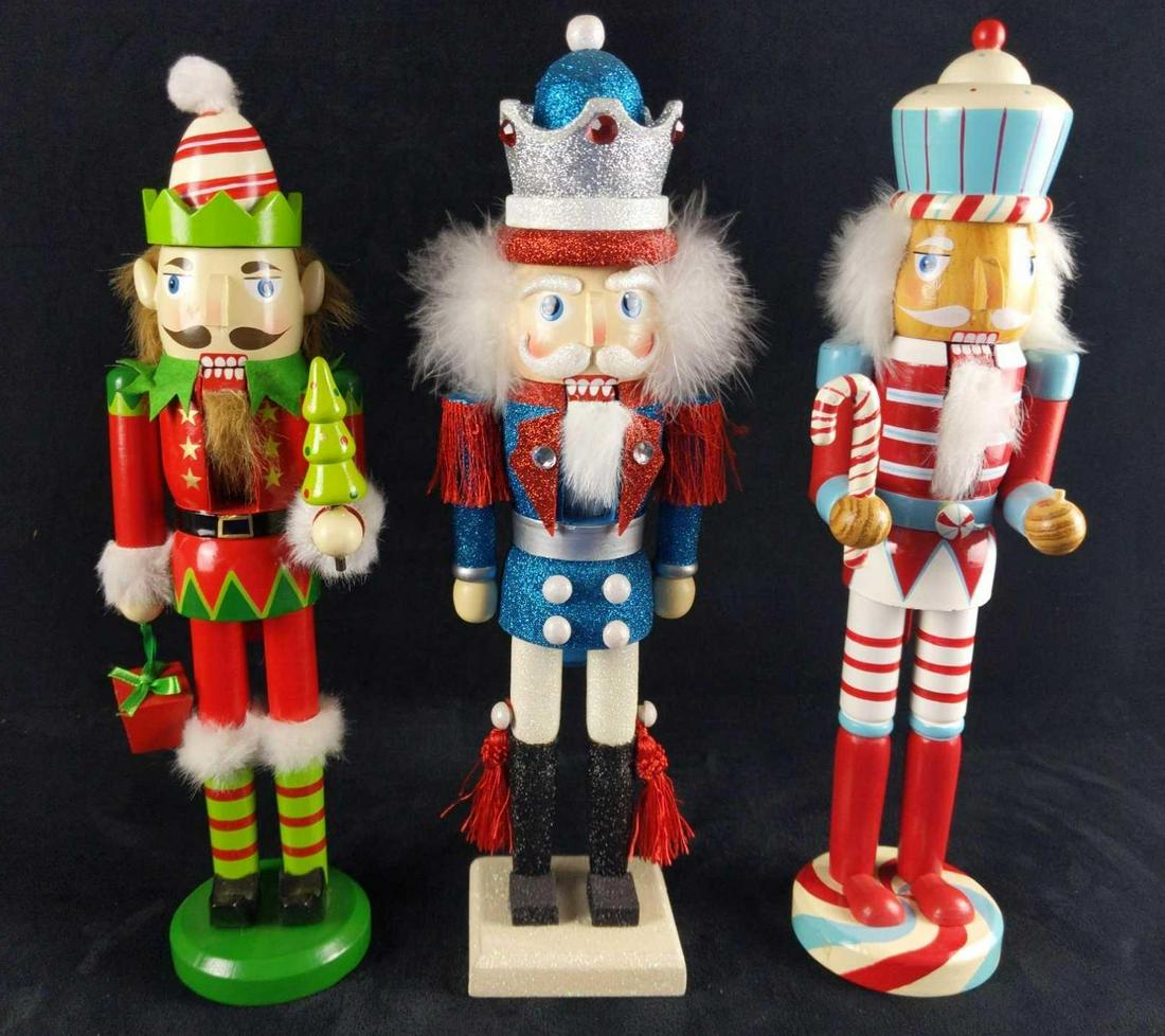Three Bright And Colorful Wooden Nutcrackers Christmas: Don't have time for drab nutcrackers? Here are some colorful nutcrackers that will turn your house from ho-ho-hum to ho-ho-hurray! This lot includes: (1) Christmas 2014: Rock'n Aqua Candy Cane Wooden
