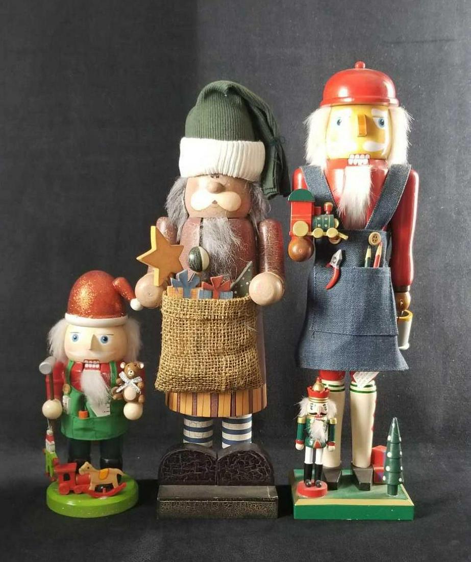 Santa Themed Christmas Nutcrackers Lot of 3: Santa themed nutcrackers is a lot of 3: All are wooden with fixed arms and in good vintage condition. 1- Santa with a woolen bag of goodies and green top cap. This has a crackle paint design. There is