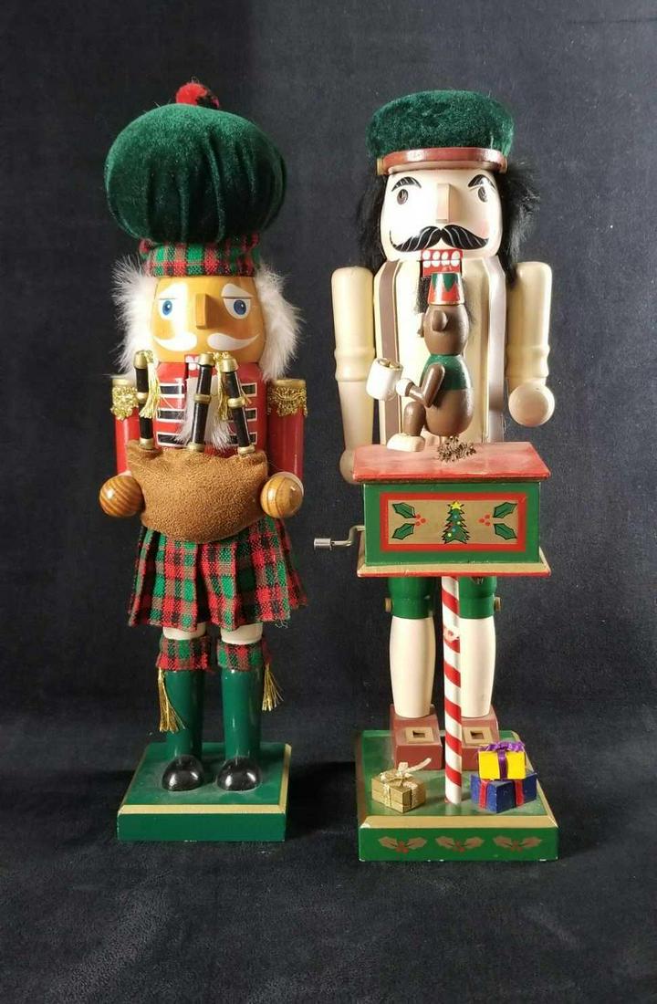 Musical Scottish Santa Nutcracker Christmas lot of 2: This lot contains: 2 wooden nutcrackers with fixed arms, square bases, and working cracker 1- Bagpipe Santa has a large hat and dressed in his colors ready to play. He has a glossy finish and no known