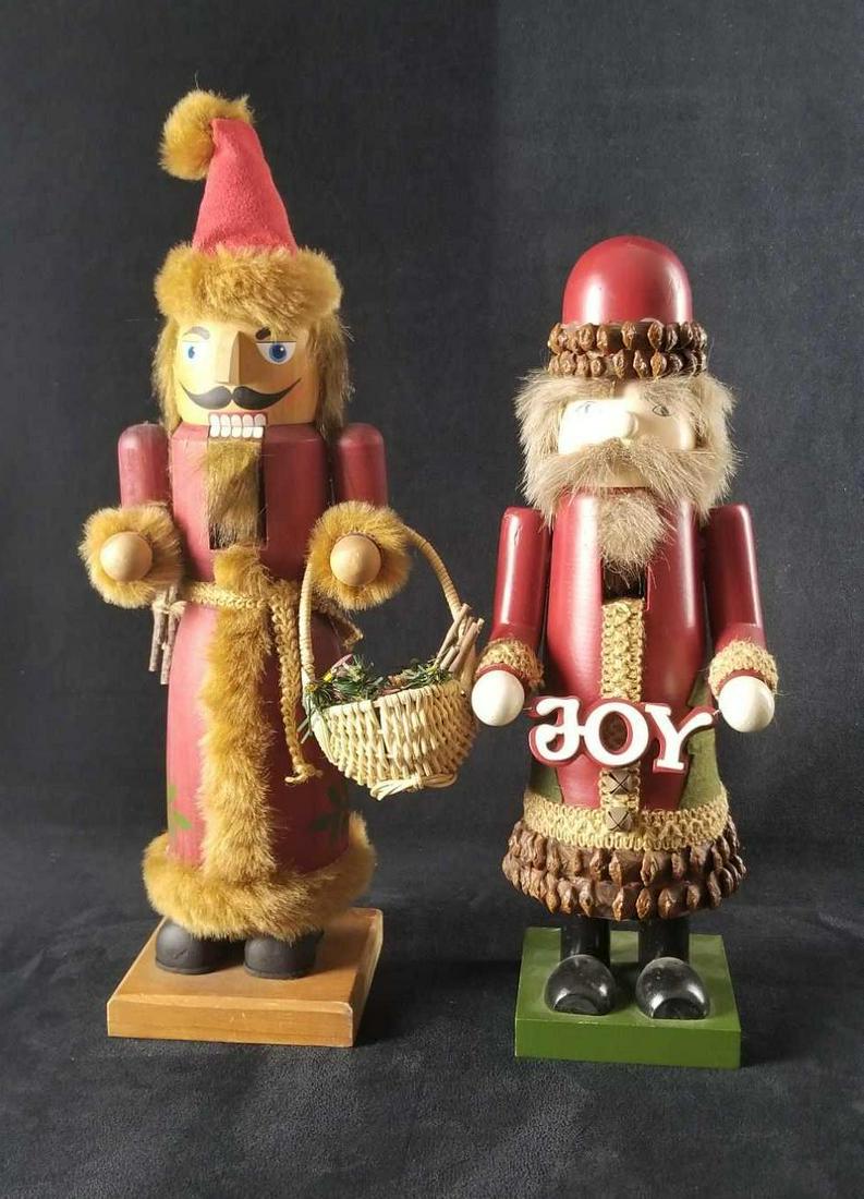 Nature Woodland Nutcracker Christmas Lot of 2: This lot contains: 1- "Joy" has a glossy paint finish, with red dome hat, linen and pine cone trim.Approx. measures 5" x 4" x 14" 1- Cardinal in a basket, has a matte finish, woolen cap and faux fur t