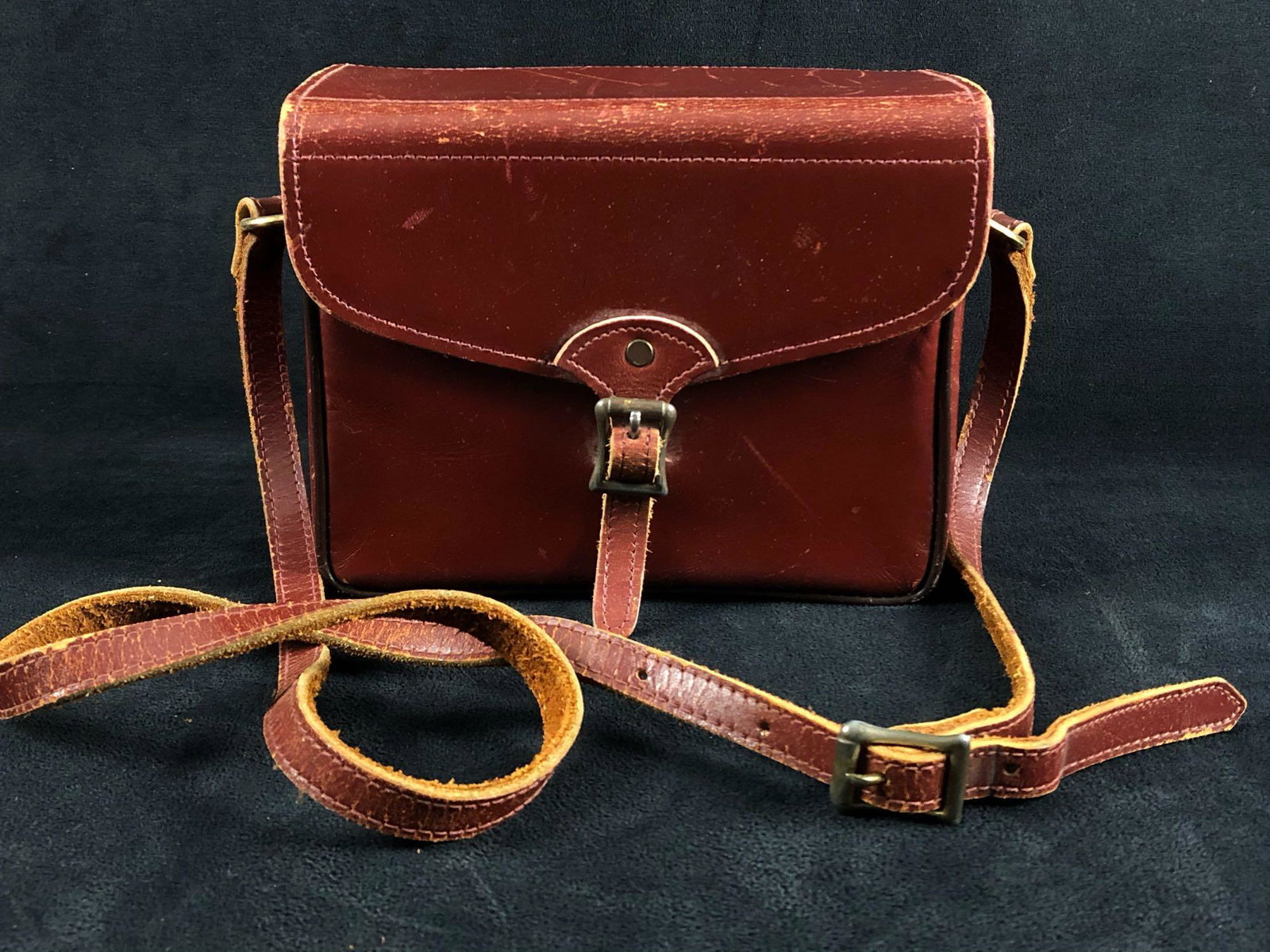 Antique Marshall Fields Company Burgundy Leather Case: Antique Marshall Fields Company Burgundy Leather Case W/ Strap & Brass Plated Buckles. This stunning leather case is very well made and looks absolutely amazing .With some scrapes and scratches to the
