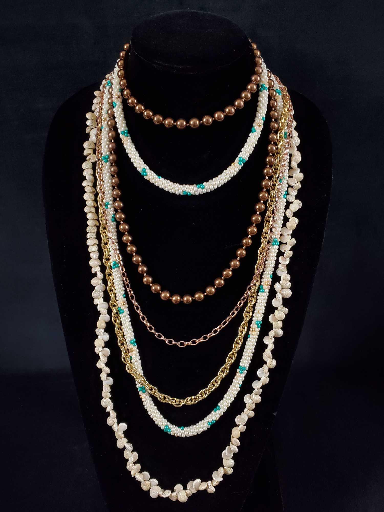 5 Piece Vintage Beaded Chain Shells Necklaces: This 5 piece lot consist of: (1) A long overlapping shell necklace. Lovely delicate piece. There are no known broken pieces however there is space on the chain as if some may be missing. Can be layere