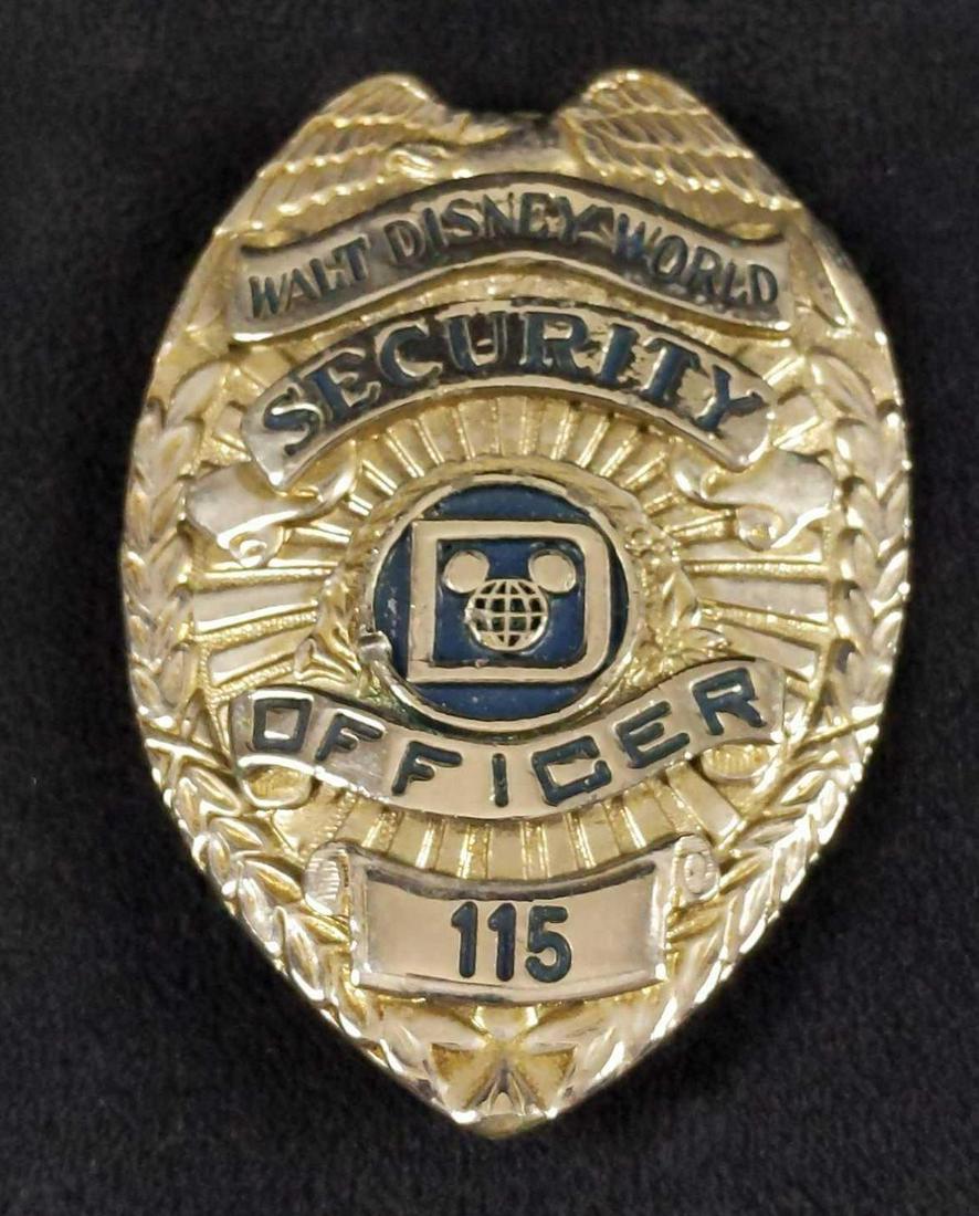 Vintage Rare Disney World Security Shirt Badge C: This badge adorned the shirt of the Walt Disney World Park Security Officer during the 1970s. Badge is approx 3" x 2".. Is in good, used condition with some light damage on the "Mickey Mouse" border o