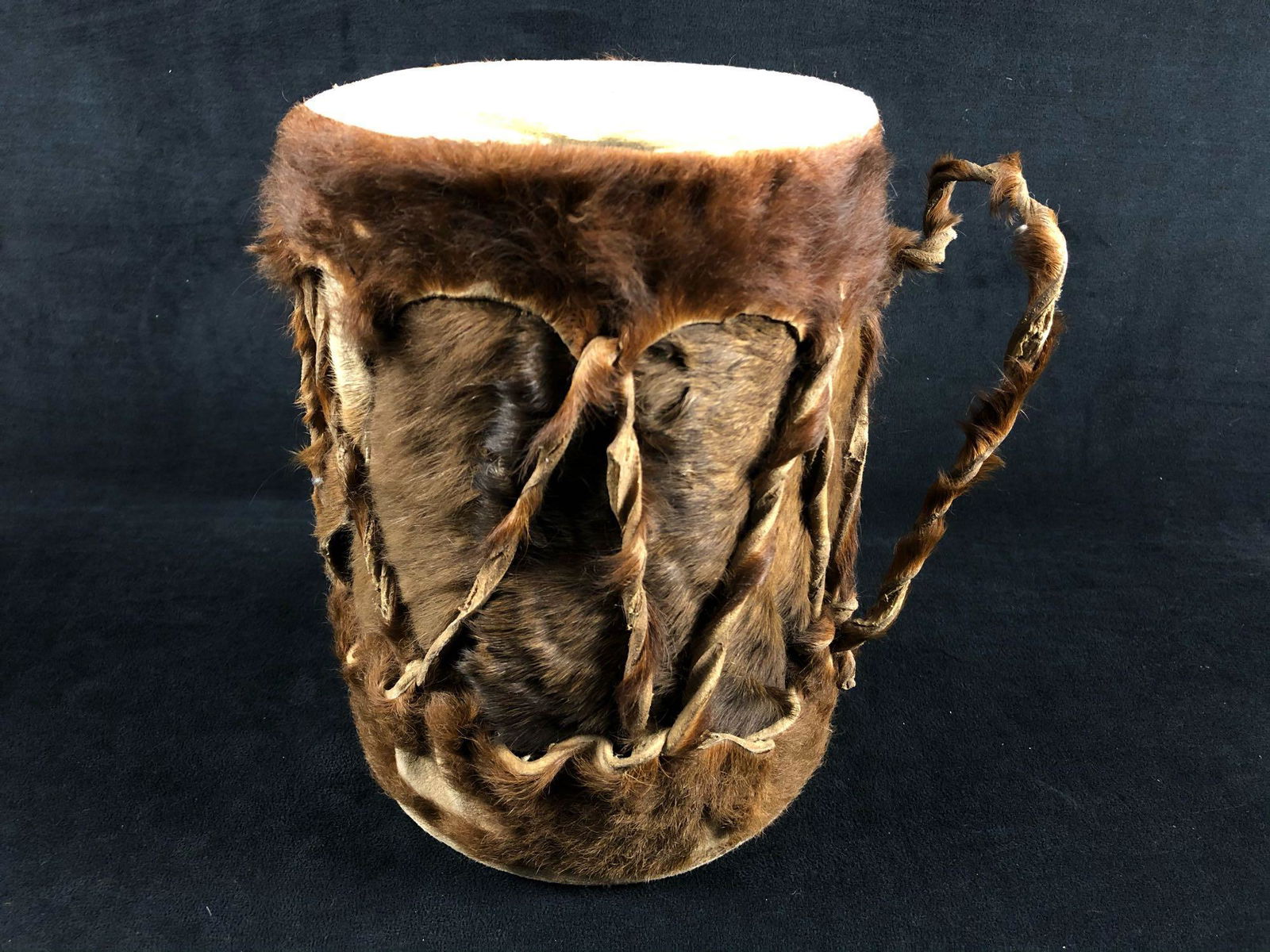 Vintage Handmade Natural Stretched Animal Hide And Fur: Vintage Natural Stretched Animal Hide Double Sided Drum.This little drum sound great and is ready to be played . no issues to be found looks and sounds perfect. Measurements are 7" x 9.5" 2 lbs