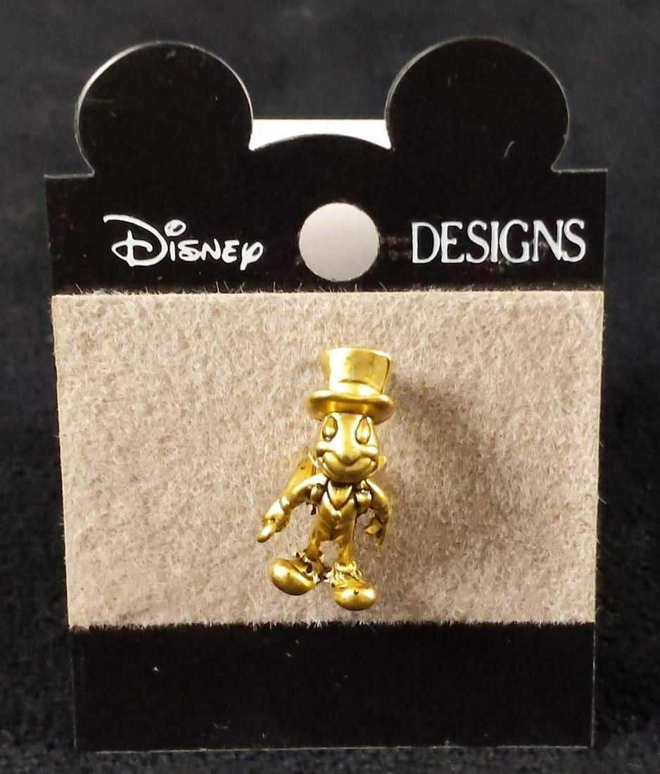 Cast Member Jiminy Cricket Environmentality Pin K: Cast Member Jiminy Cricket Environmentality Award. This pin was awarded to WDW Cast Members for being a part of an Environmentality program. Disney stopped giving this pin out in 1999. Pin and backing