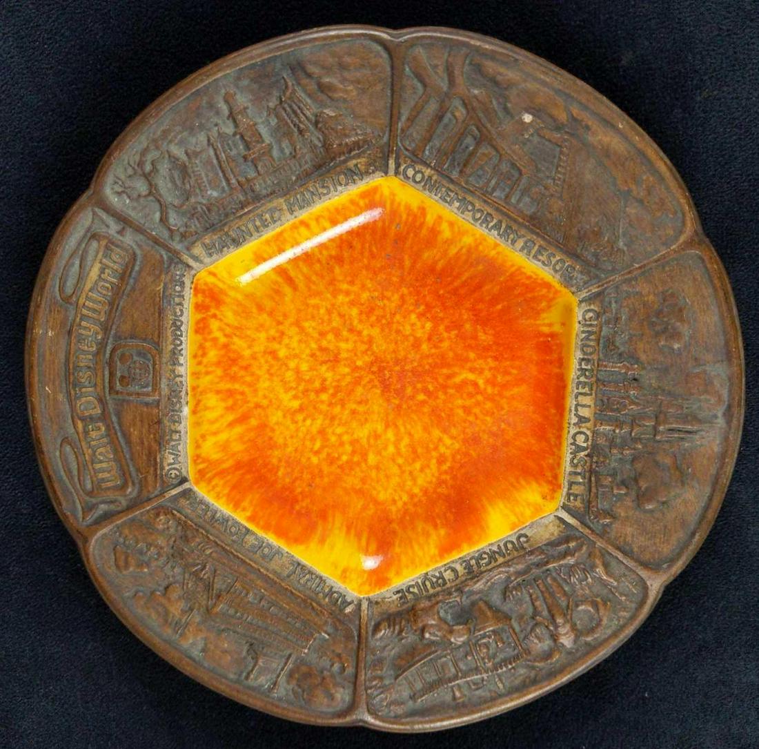 Vintage Disney World Ceramic Brown Orange Ashtray: 1970's Disney Souvenir Vintage Ashtray. Shows images of five iconic attractions: Haunted Mansion, the Contemporary Resort, Cinderella Castle, Jungle Cruise, and Admiral Joe Fowler. Is approx 8" x 8"x