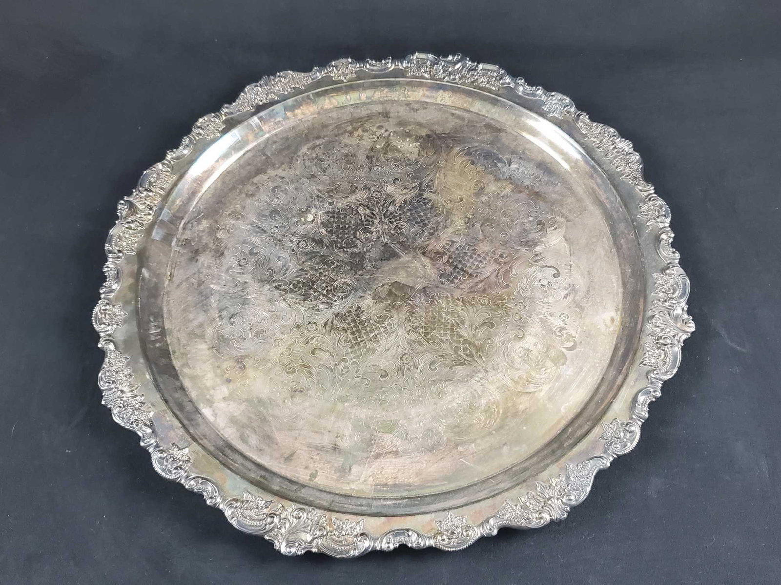 Large Baroque Style Wallace Silverplate Platter: Large vintage round Baroque Style Wallace Silverplate Platter. Measures approx 20" across. Marked on the bottom: "Baroque By Wallace 242". Platter is in good, vintage condition with light tarnish and 