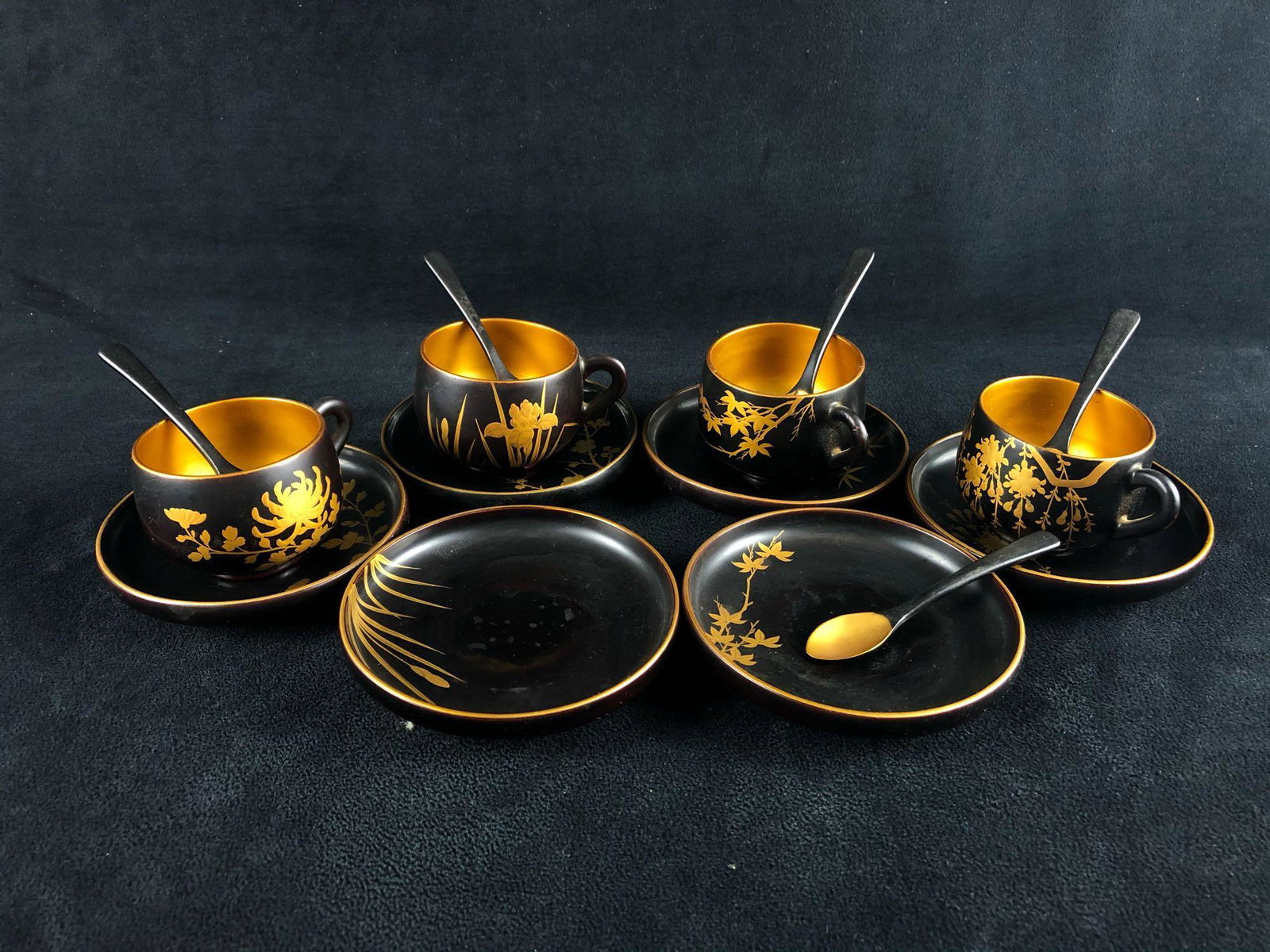 Vintage Mid-Century Japanese Black Lacquer & Gold: Vintage Mid-Century Japanese Black Lacquer & Gold Gilded Floral Tea Set. This Vintage tea set with its hand painted gold flowers is in very good condition except for one tea cup has a chip on the bott