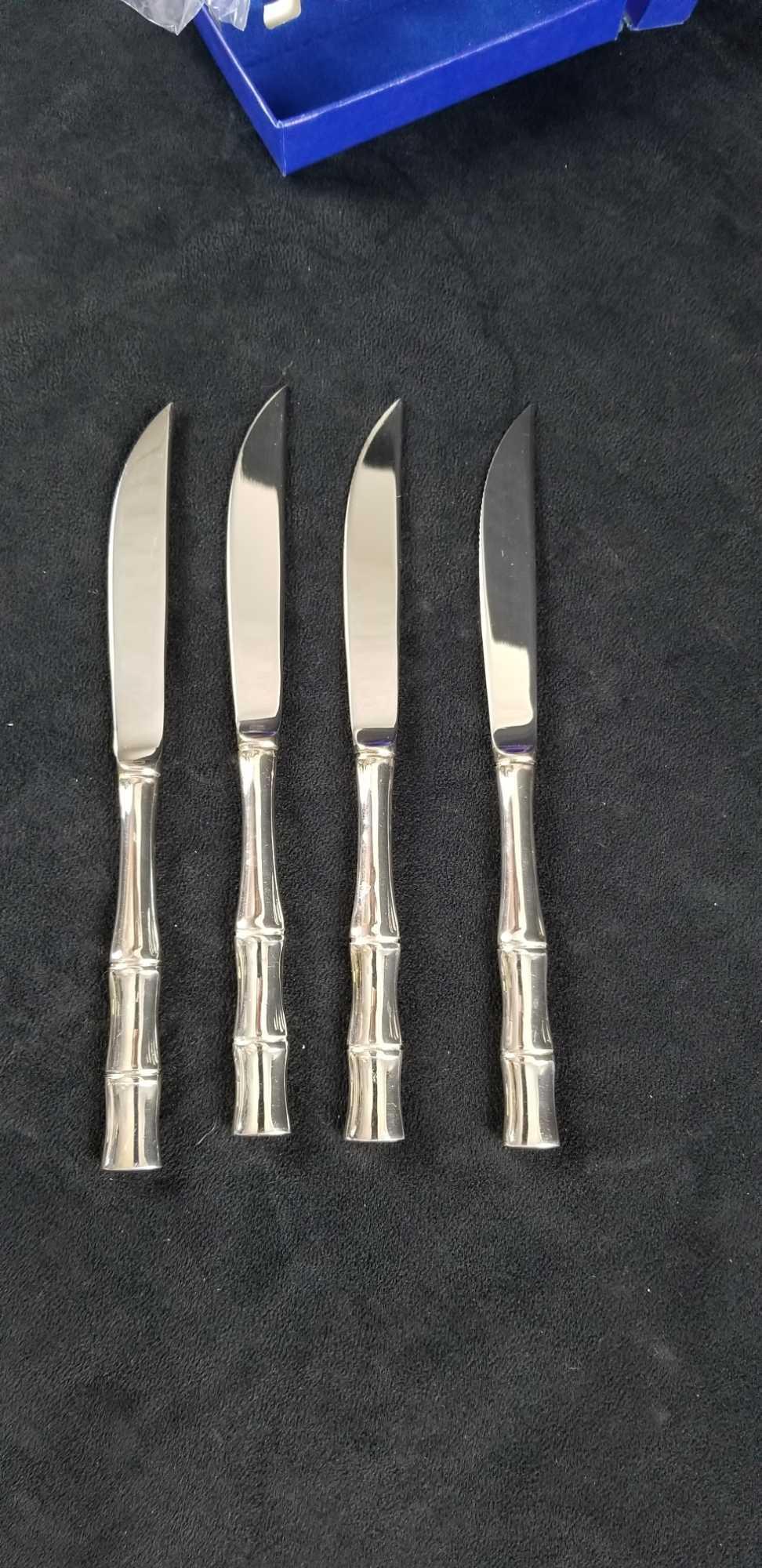 William Adams Bamboo Steak Knives: William Adams style Bamboo Steak Knives set of 8. The knives are unmarked but come in a blue felt box marked on the top. Each knife comes in a plastic sleeve. They are in good unused condition. Approx