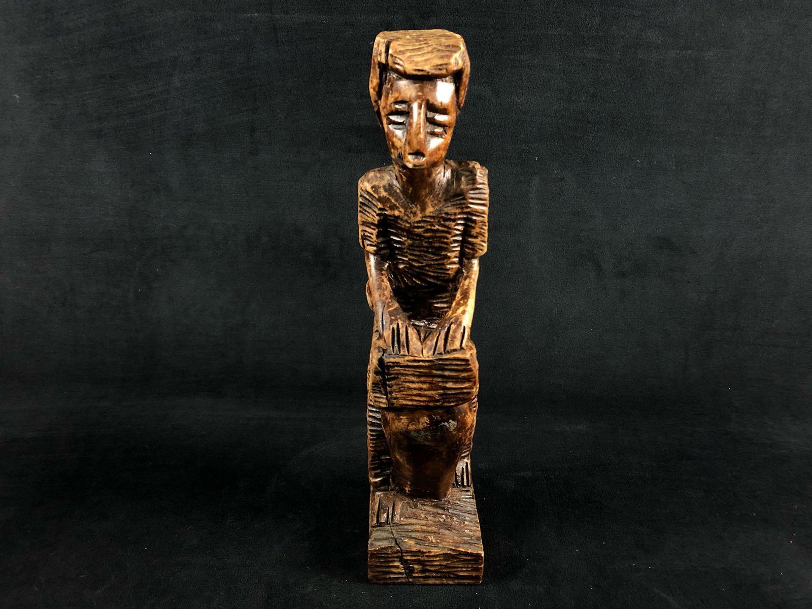 Vintage Hand Carved African Wood " Man Playing A Drum ": Vintage Hand Carved African Wood " Man Playing A Drum " Statue Figure. This piece of handmade folk art is in good condition with some light stain loss and nicks can be found .Measurements are 3" at th