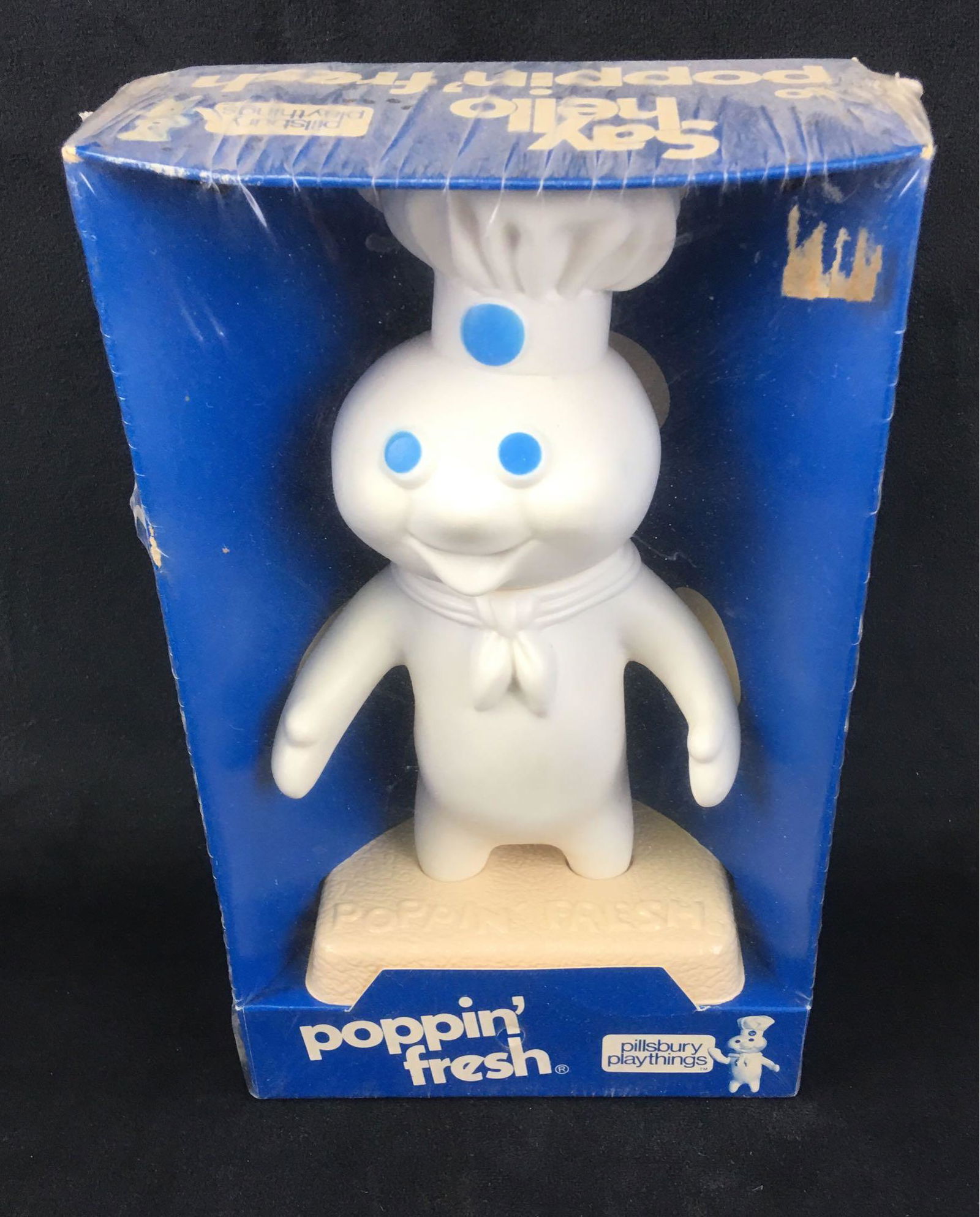 Vintage Pillsbury Poppin' Fresh Dough Boy 7" Vinyl: Vintage Pillsbury Poppin' Fresh Dough Boy 7" Vinyl Squeeze Doll Circa 1971; unopened in the original packaging. The Dough Boy and package are both in very good condition. Th4e cellophane wrap is in ta