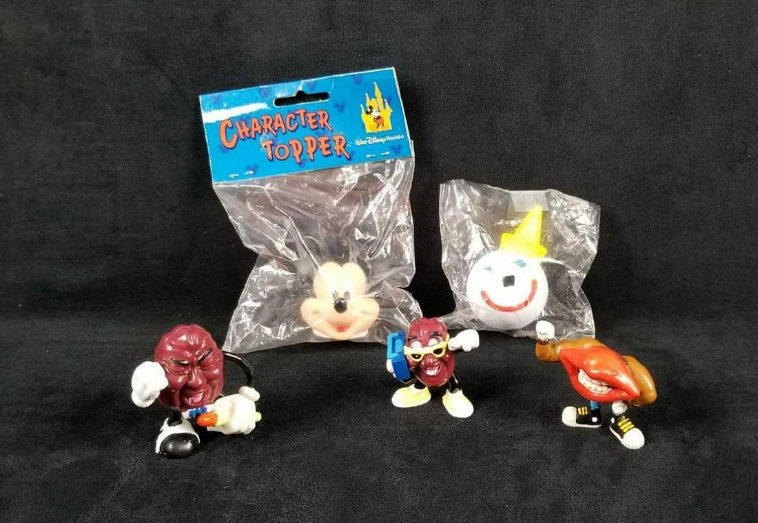 Vintage 1980s California Raisins PVC Toy Figures: This vintage lot contains: 1- 1987 California Raisin with microphone by Calrab Applause, approx. measures 2 1/4" x 1 1/2" x 2 1/2" 1- 1988 California Raisin with boombox by Calrab Applause, approx. me