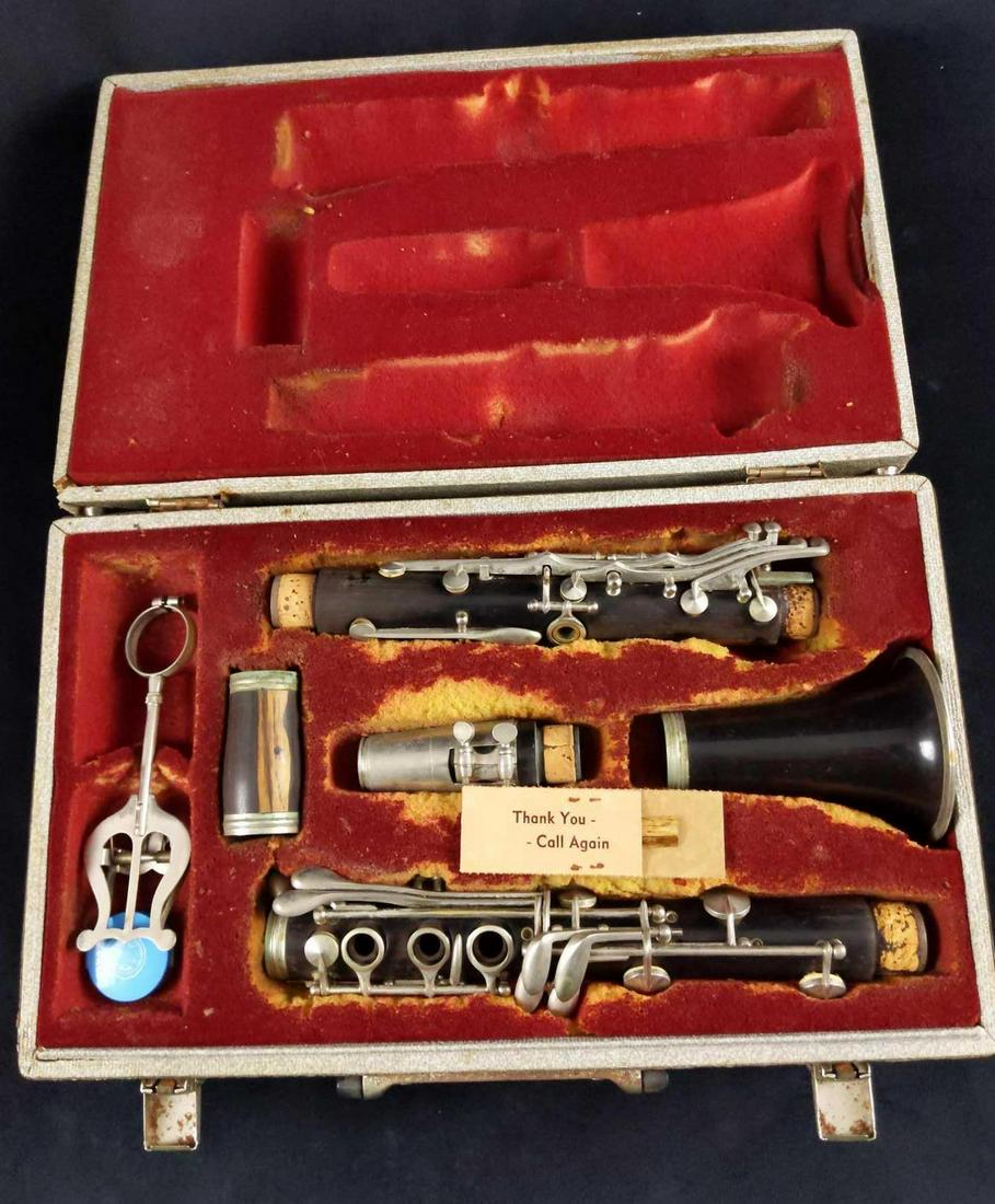 Vintage Early 20th Clarinet In A Carrying Case: Here is a vintage clarinet that comes in a carrying case. Each piece is represented here from the mouth-piece, the barrel, both upper and lower joints, and the bell. Pieces are all in good. vintage co