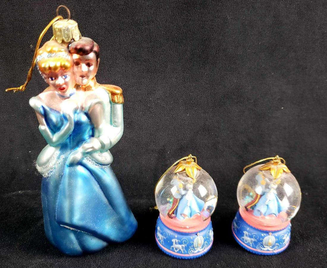 Lot of 3 Cinderella and Prince Charming Themed: Lot of 3 Cinderella and Prince Charming Themed Christmas Ornaments. This lot of ornaments is in overall good used condition. The items have no known signs of damage such as chips, cracks or other impe