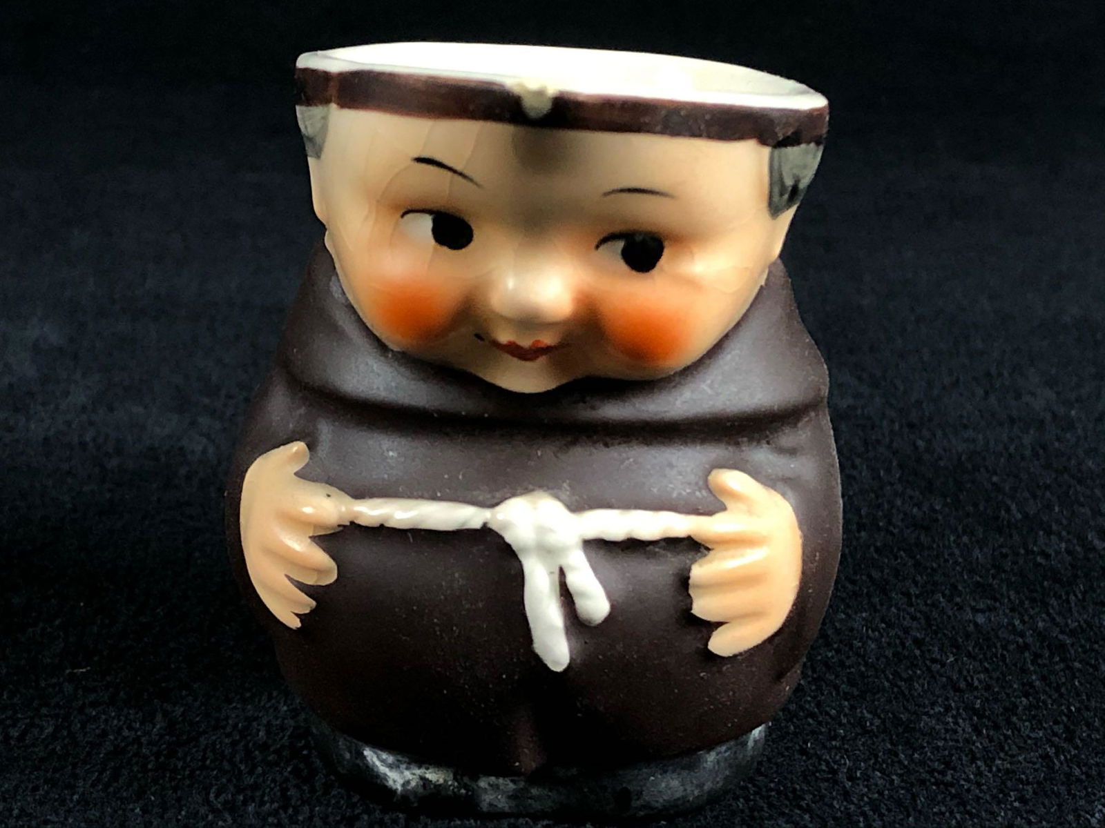 Goebel 2.5â€ Monk Friar Tuck Creamer W. Germany: Goebel 2.5” Monk Friar Tuck Creamer W. Germany. Some crazing on the face as pictured and tiny chip on the spout end.